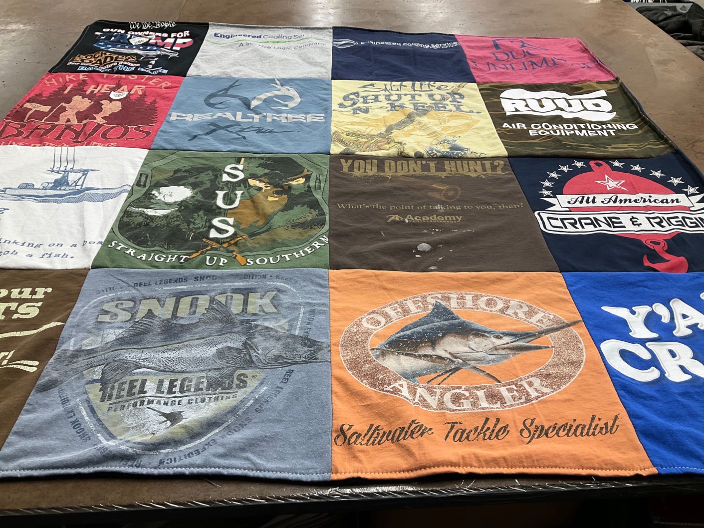 T-shirt quilt with fishing, hunting themes by BLAINE from FL