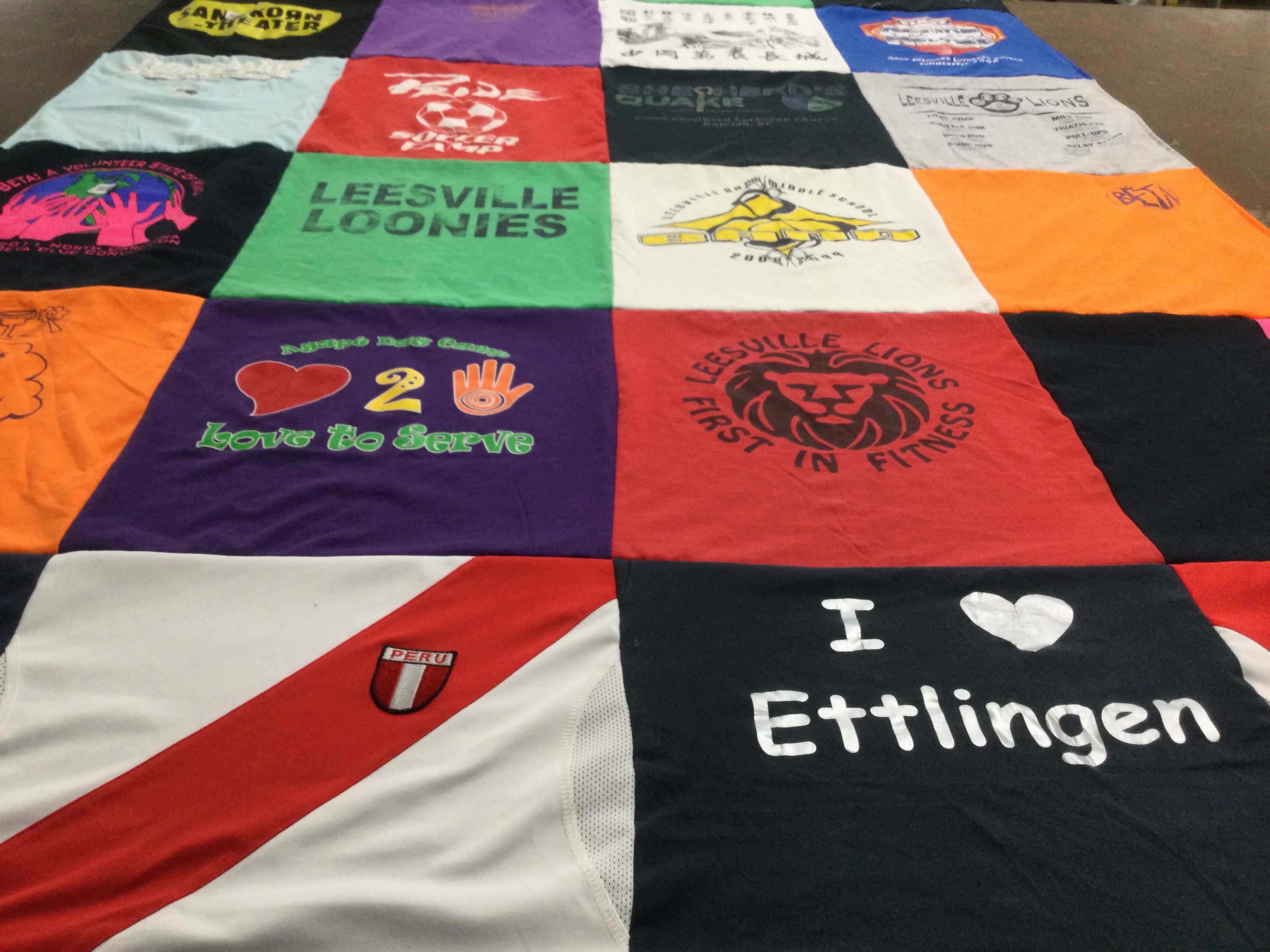 T-shirt quilt with volunteering, sports themes by Kristen from WV