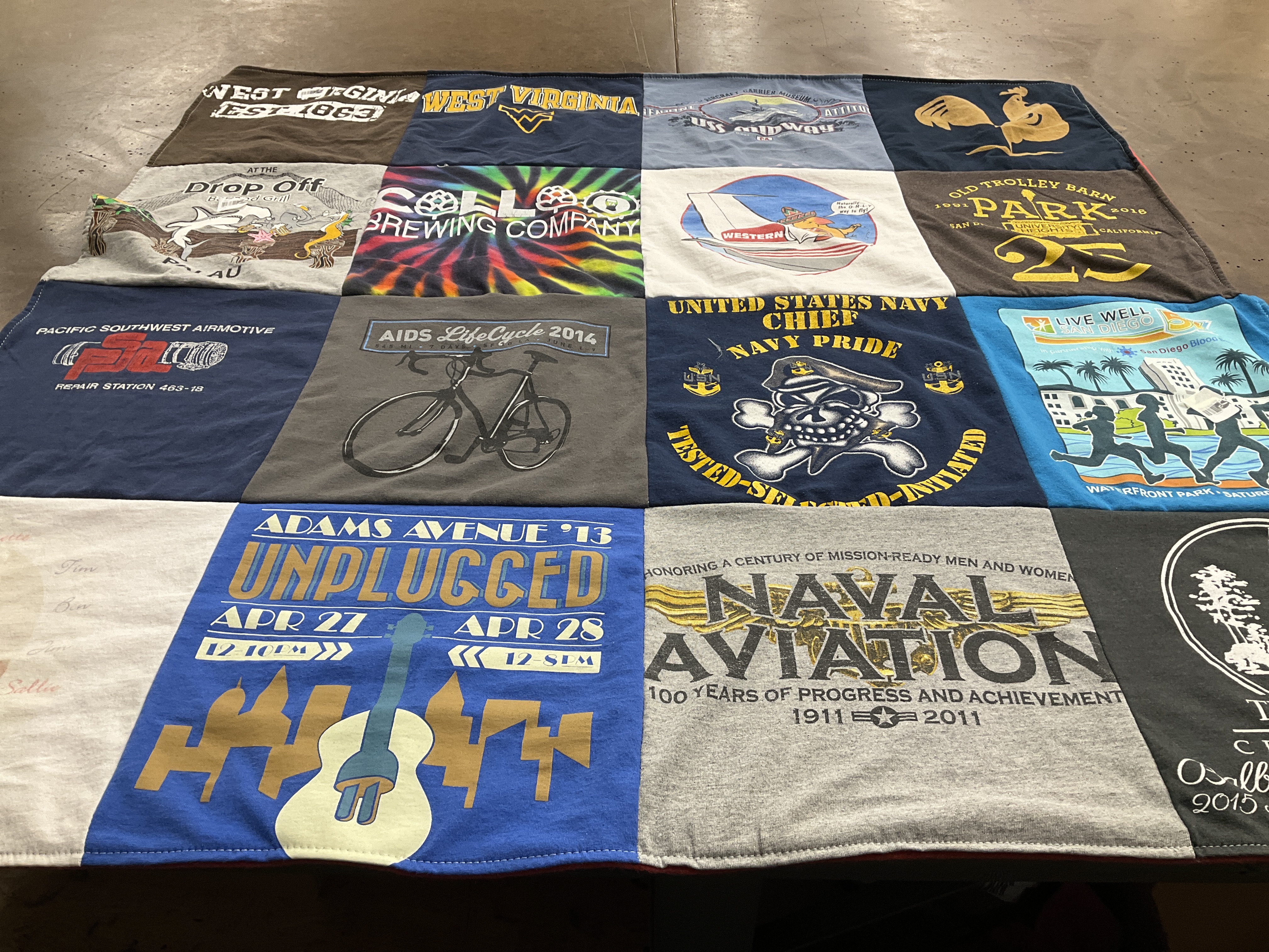 T-shirt quilt with cycling, music themes by Janet from CA