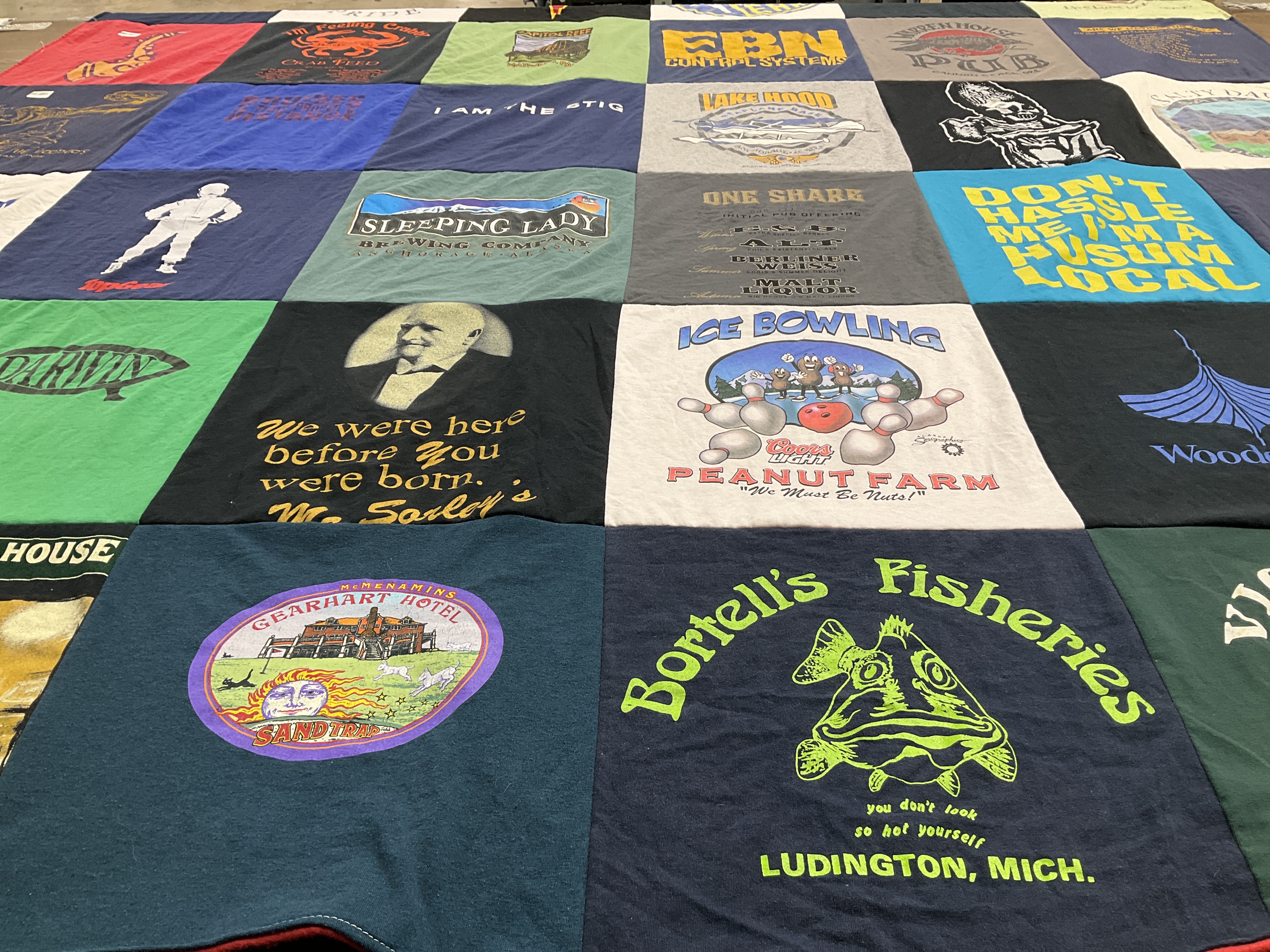 T-shirt quilt with brewing, fishing themes by Allison from WA