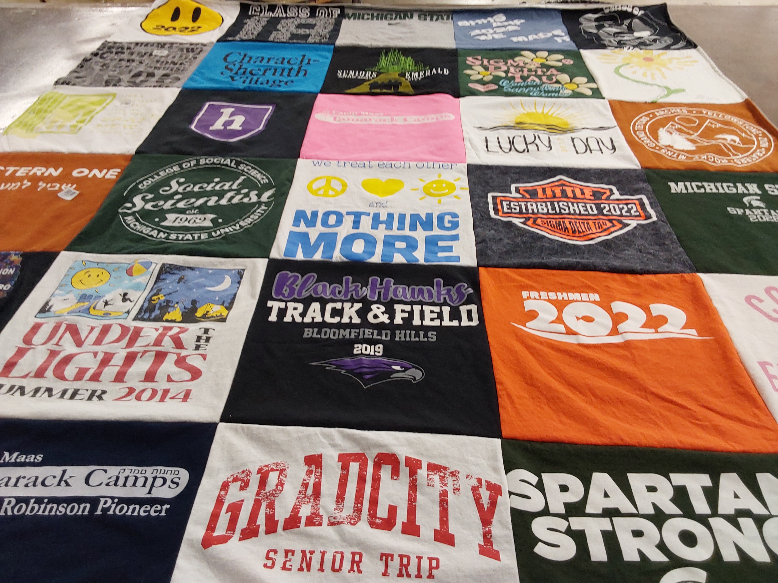 T-shirt quilt featuring blackhawks track & field, spartan strong by Tracy from MI