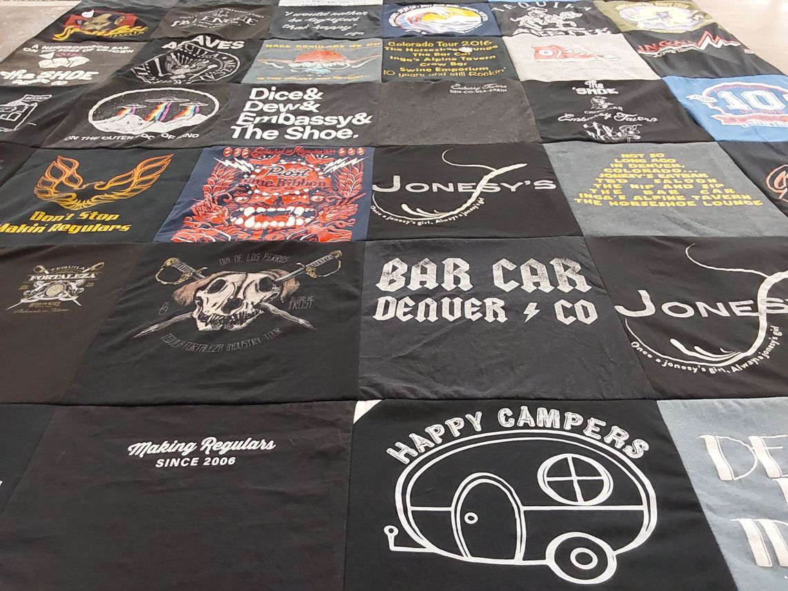 T-shirt quilt with camping, music themes by Rachel M from CO