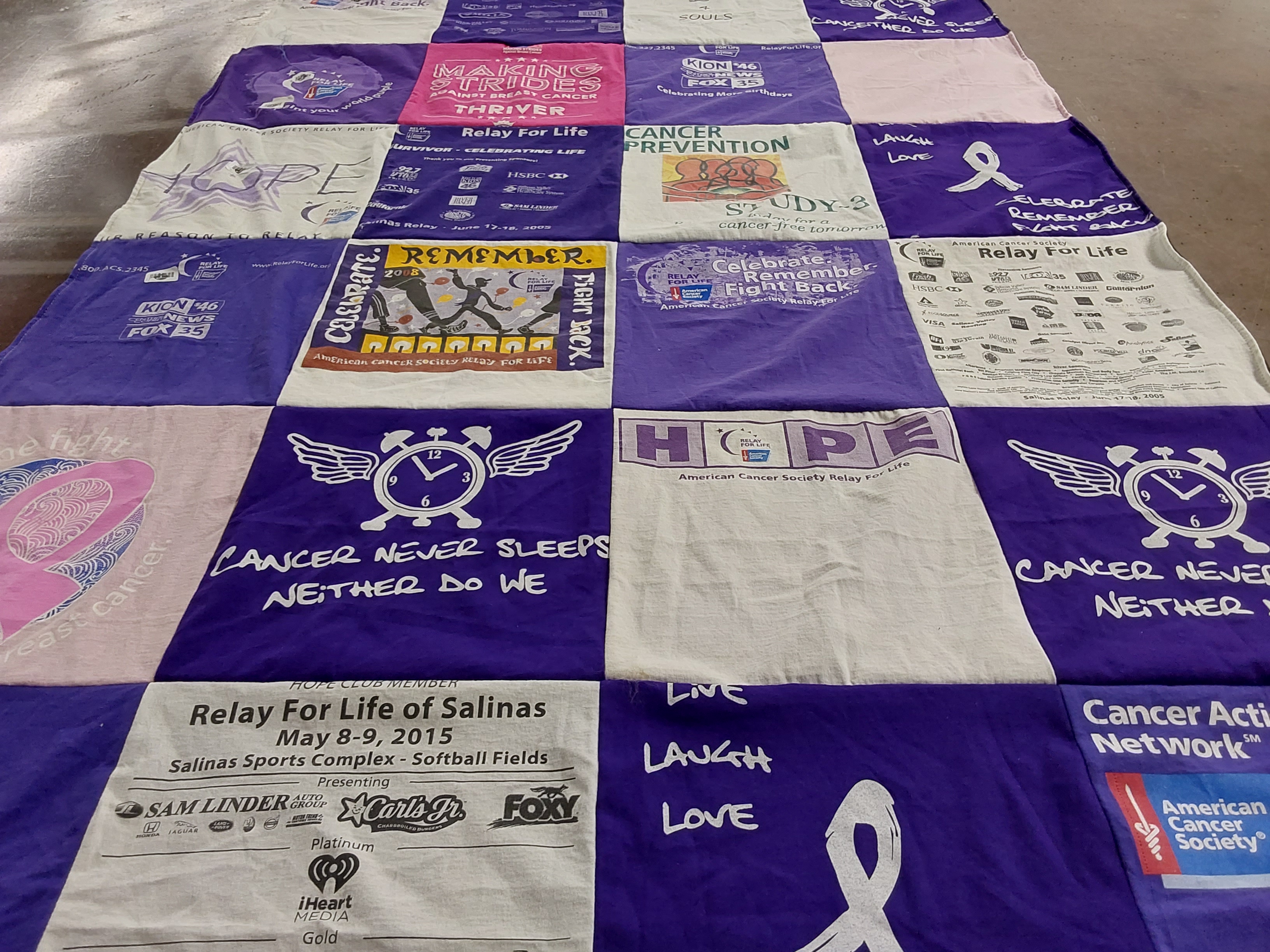T-shirt quilt with cancer awareness, community service themes by Jackie from CA