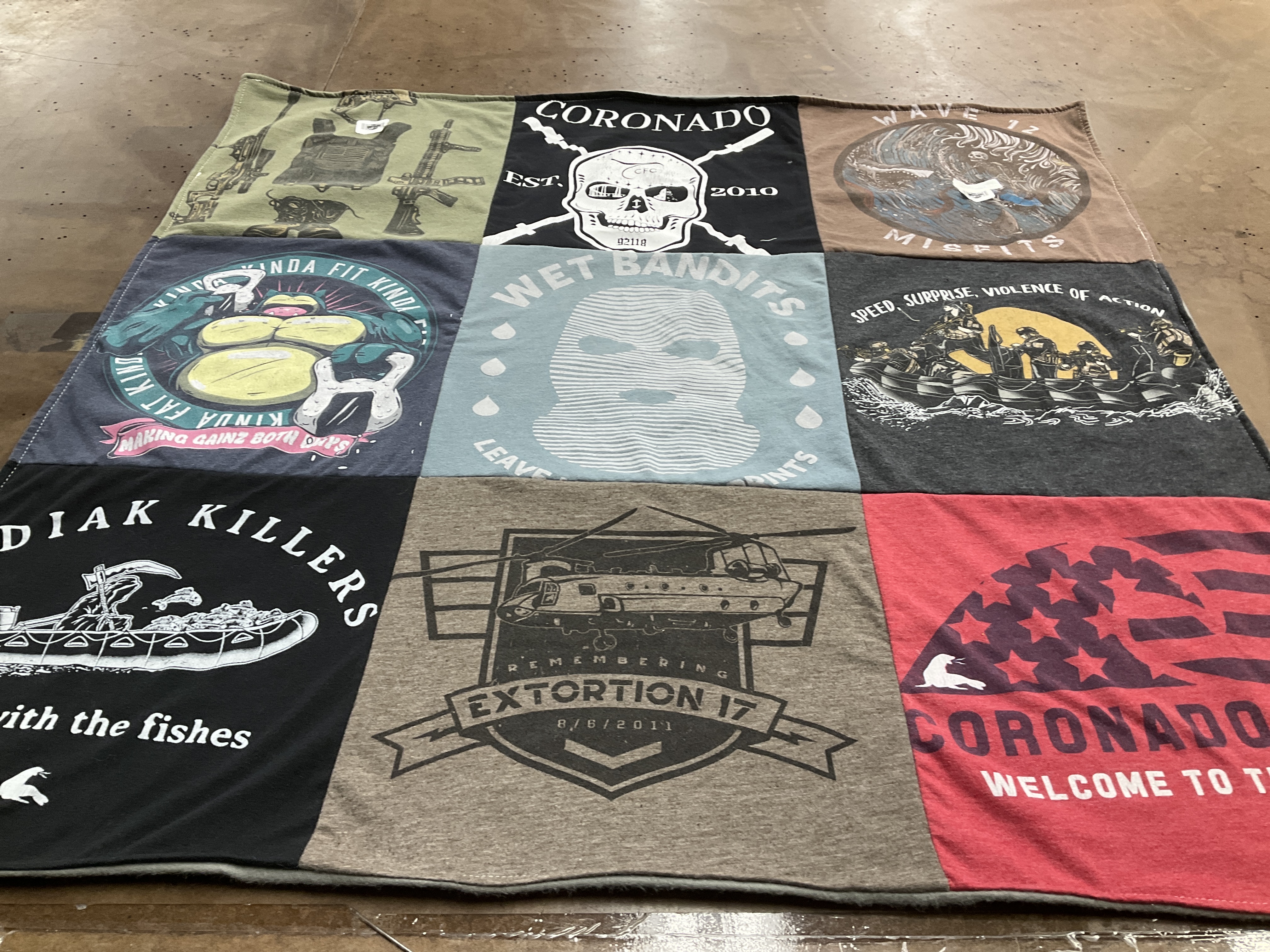 T-shirt quilt with fishing, fitness themes by Christian from CA