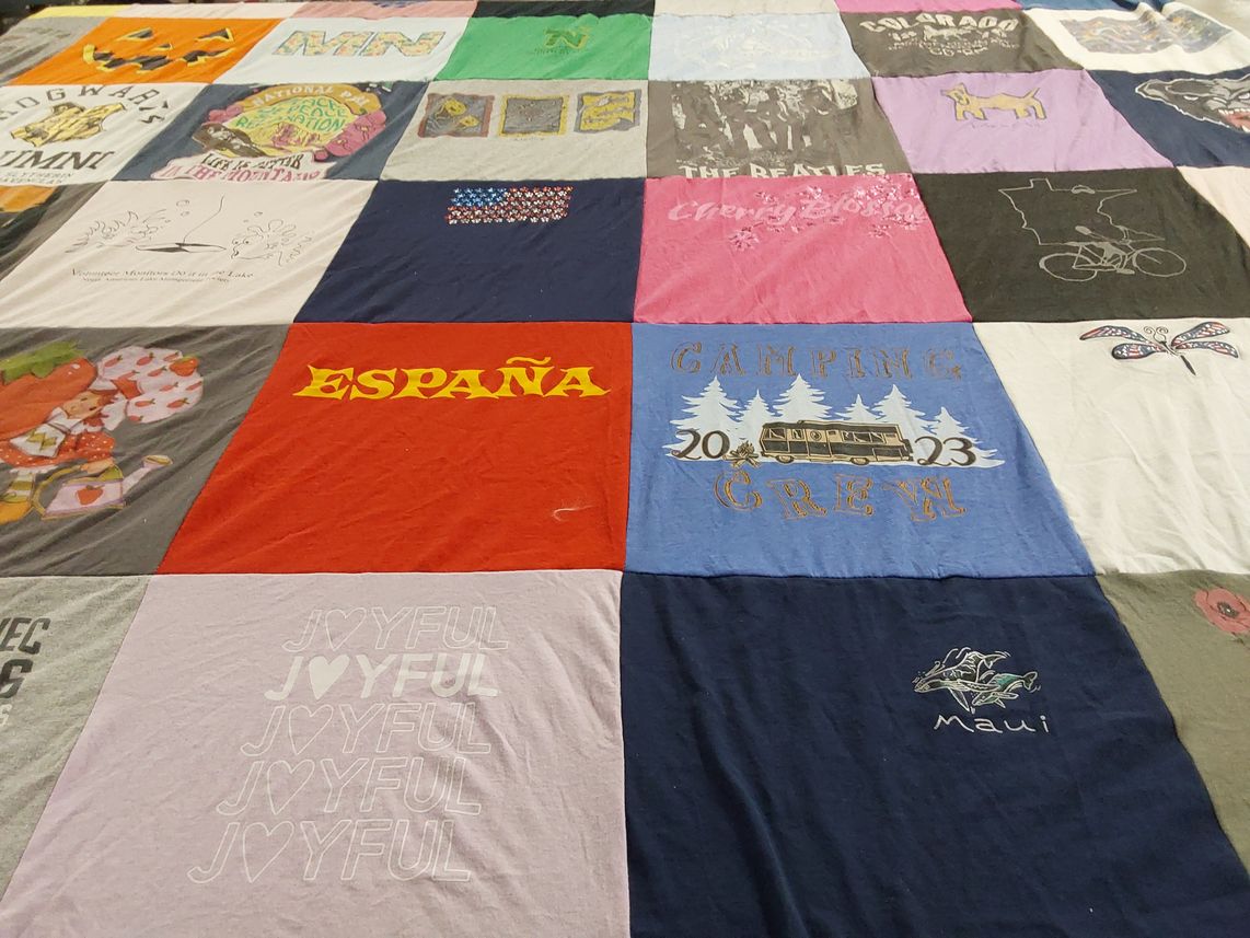 T-shirt quilt with camping, travel themes by Judy from MN