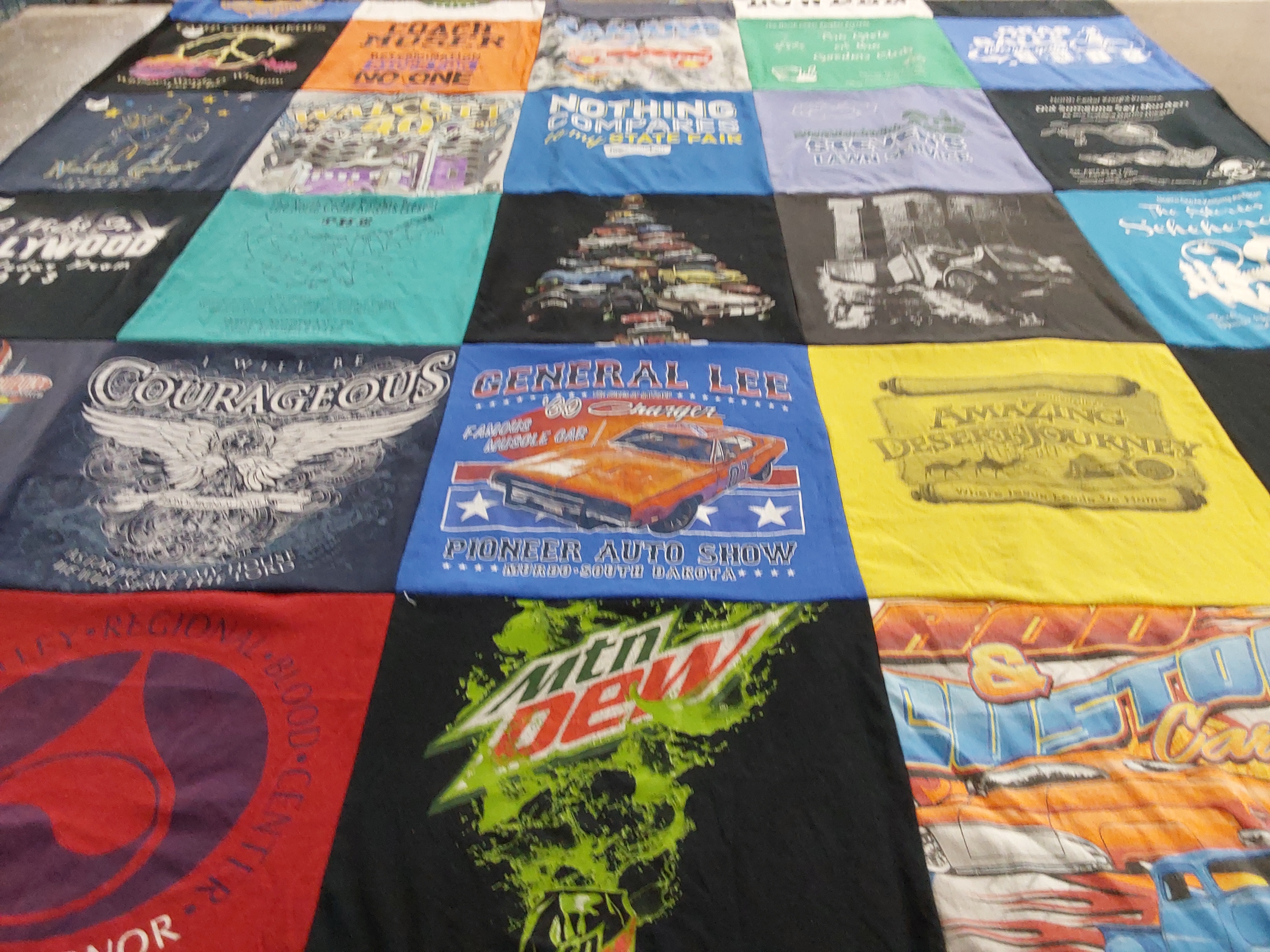 T-shirt quilt with auto shows, car racing themes by Deanna from IA