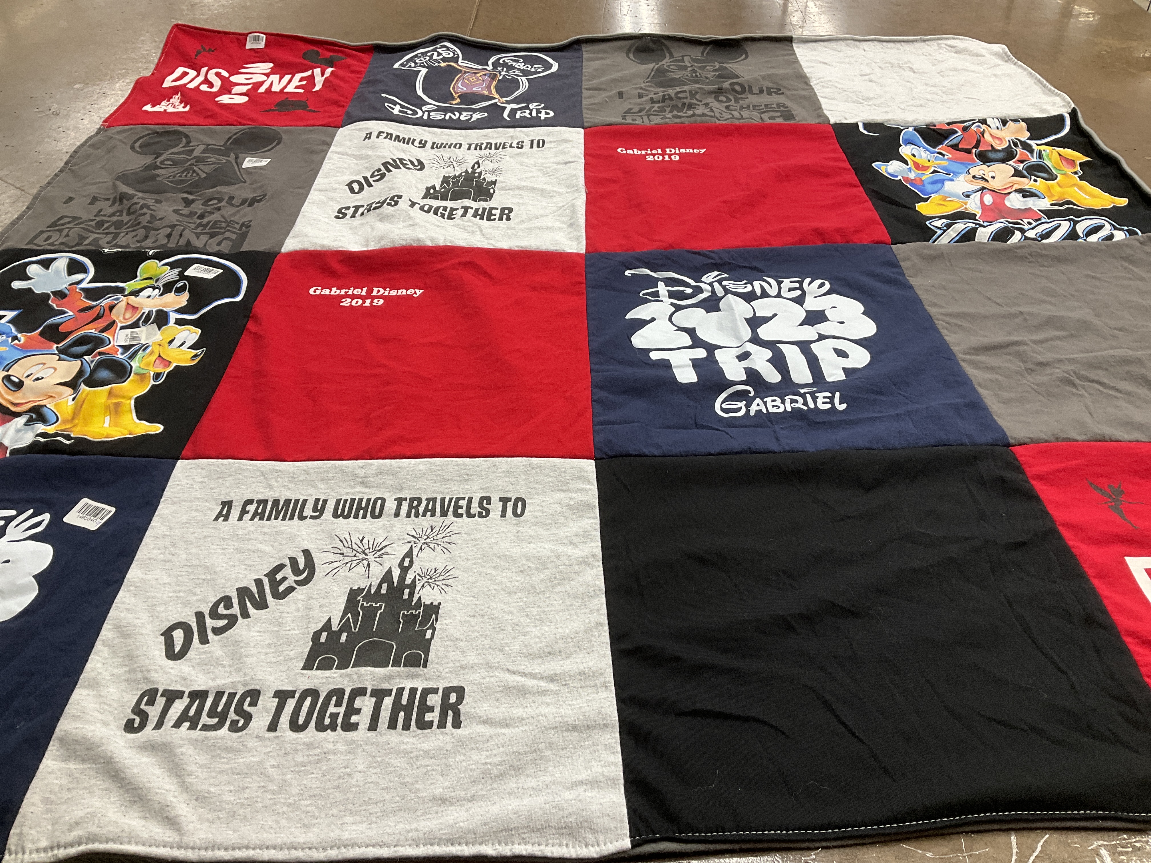 T-shirt quilt with disney, family travel themes by Dora from OH