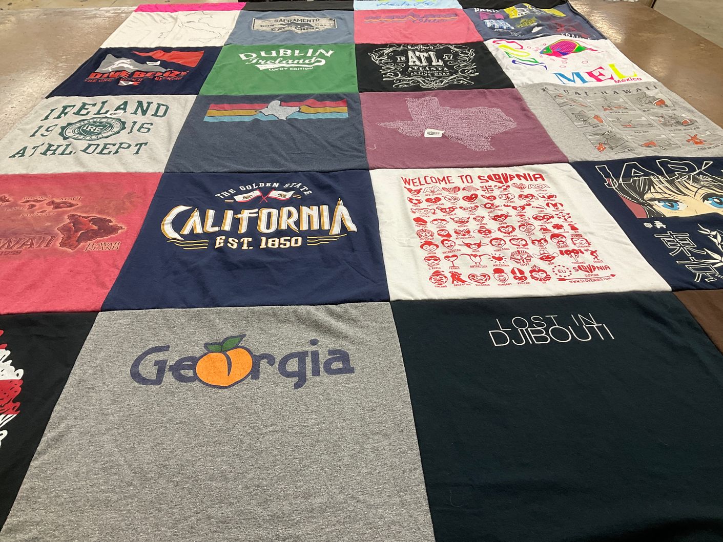 T-shirt quilt with travel, geography themes by Sherri from TX