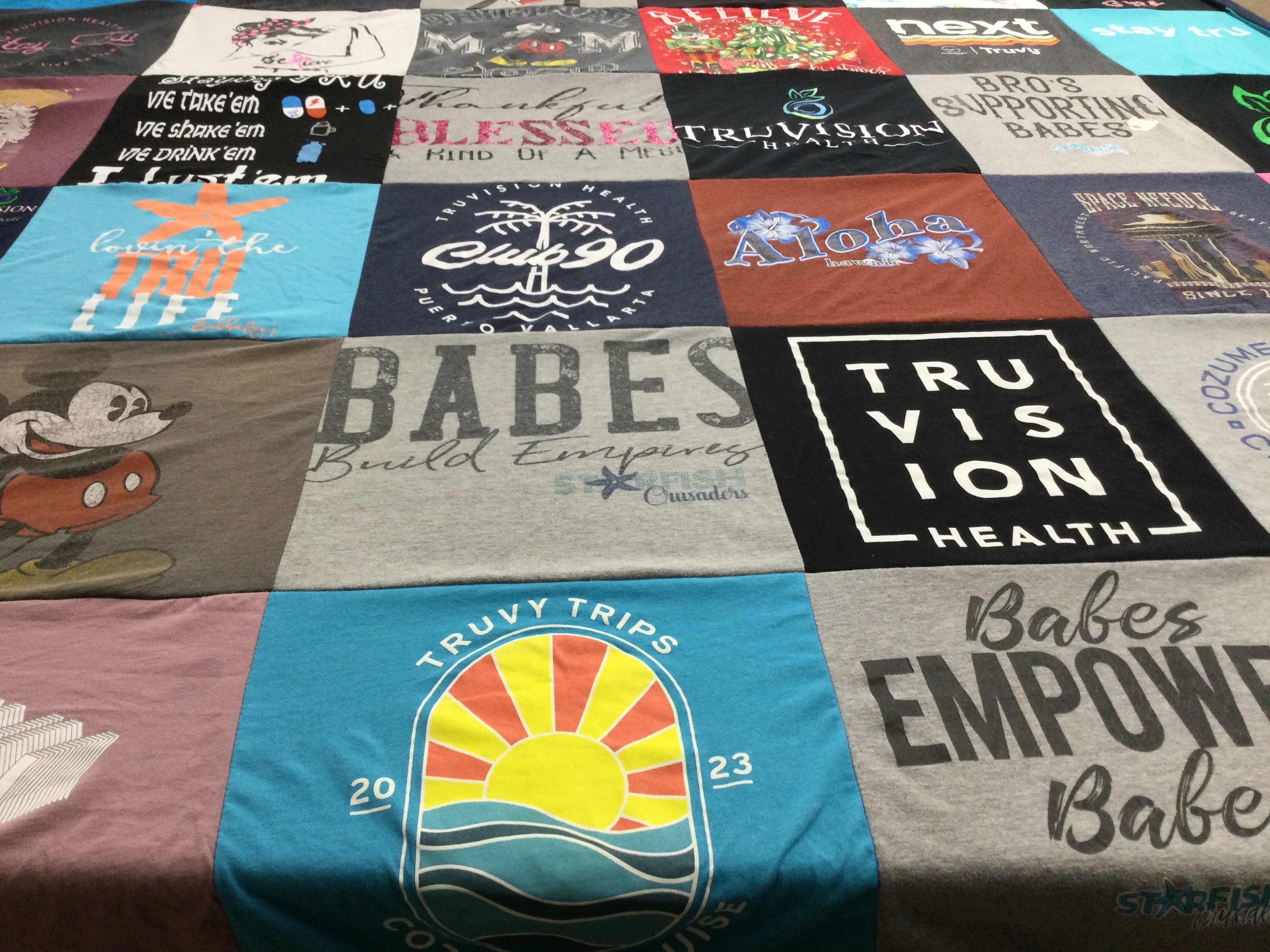 T-shirt quilt with health, travel themes by Miranda from MI