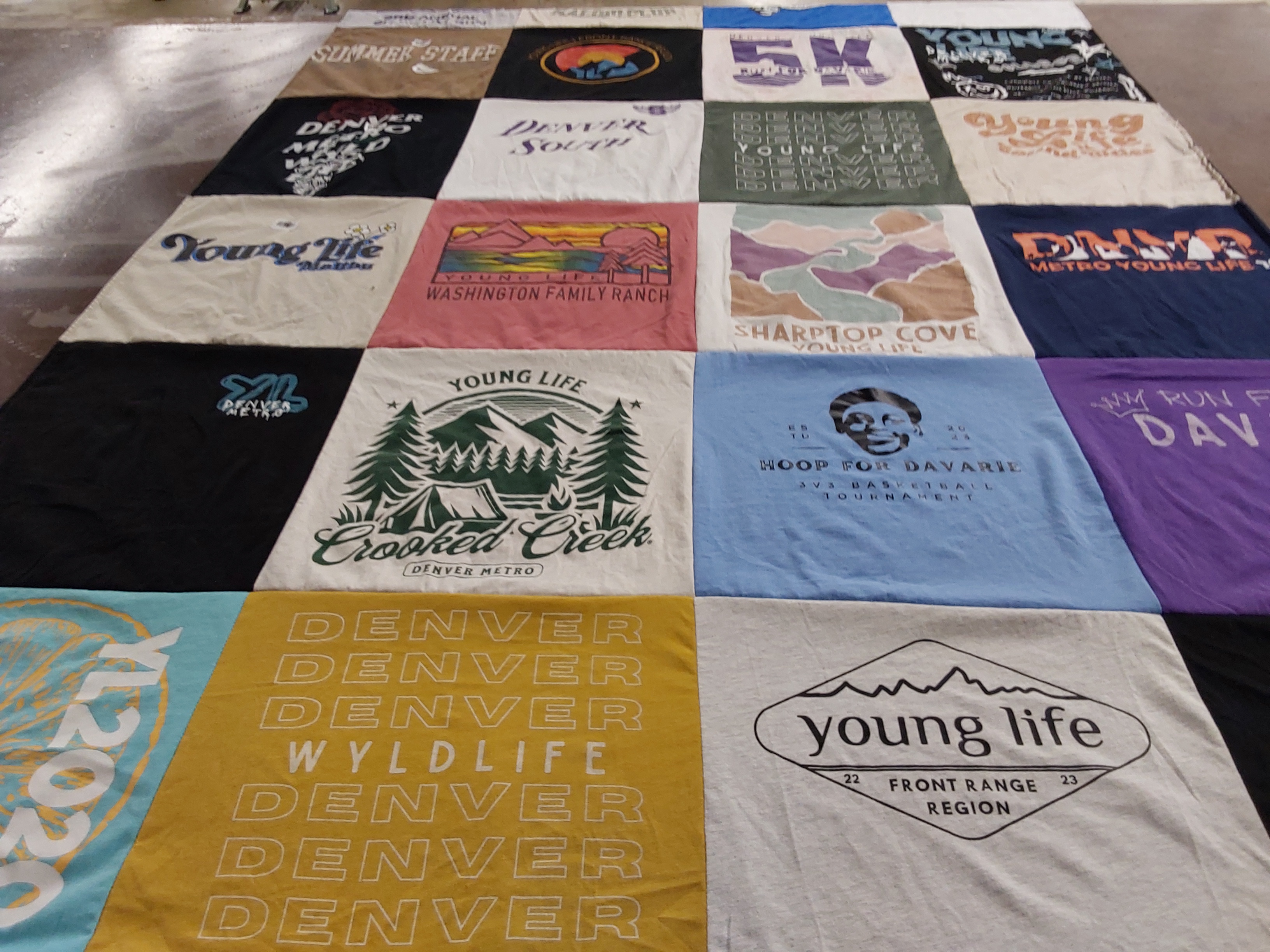 T-shirt quilt with camping, community themes by Kelsey from CO