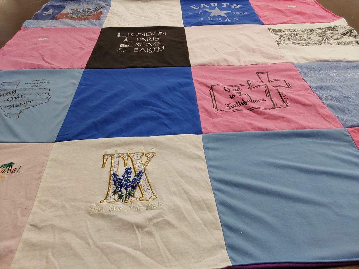 T-shirt quilt with travel, faith themes by Evelyn from TX
