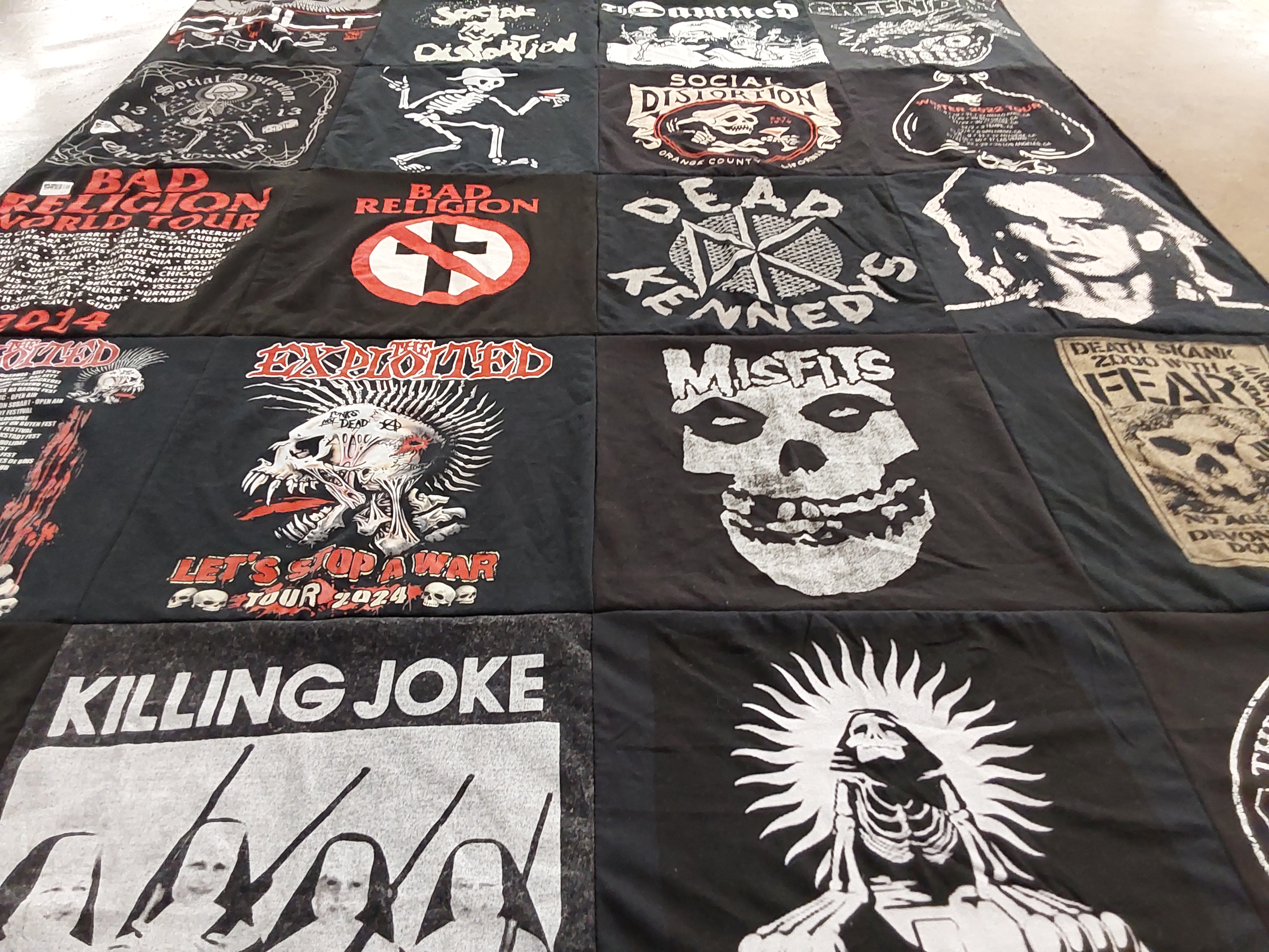 T-shirt quilt with punk, music themes by Derek from GA