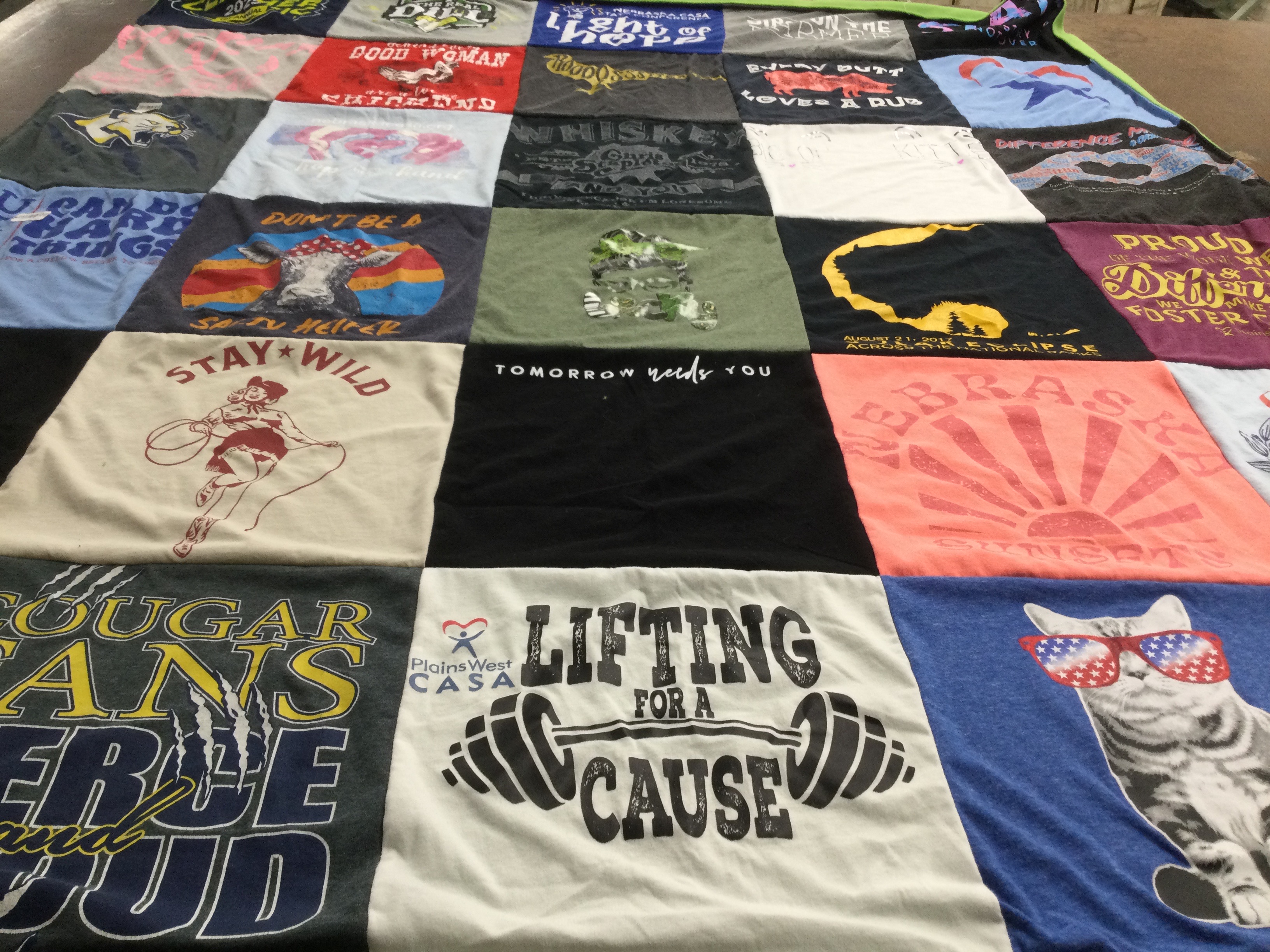 T-shirt quilt with sports, fitness themes by Korey from NE