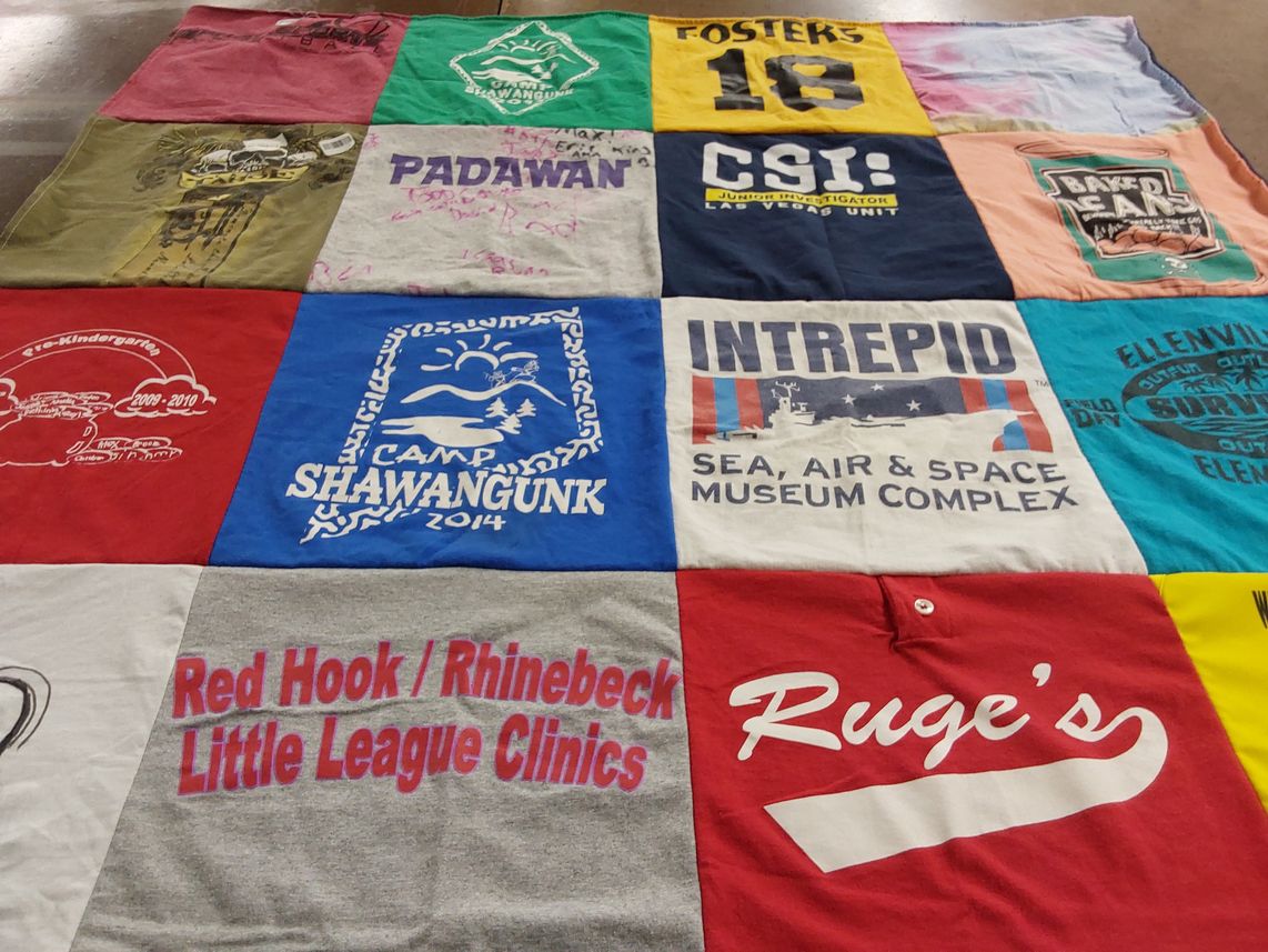T-shirt quilt with camping, sports themes by Regan from NY