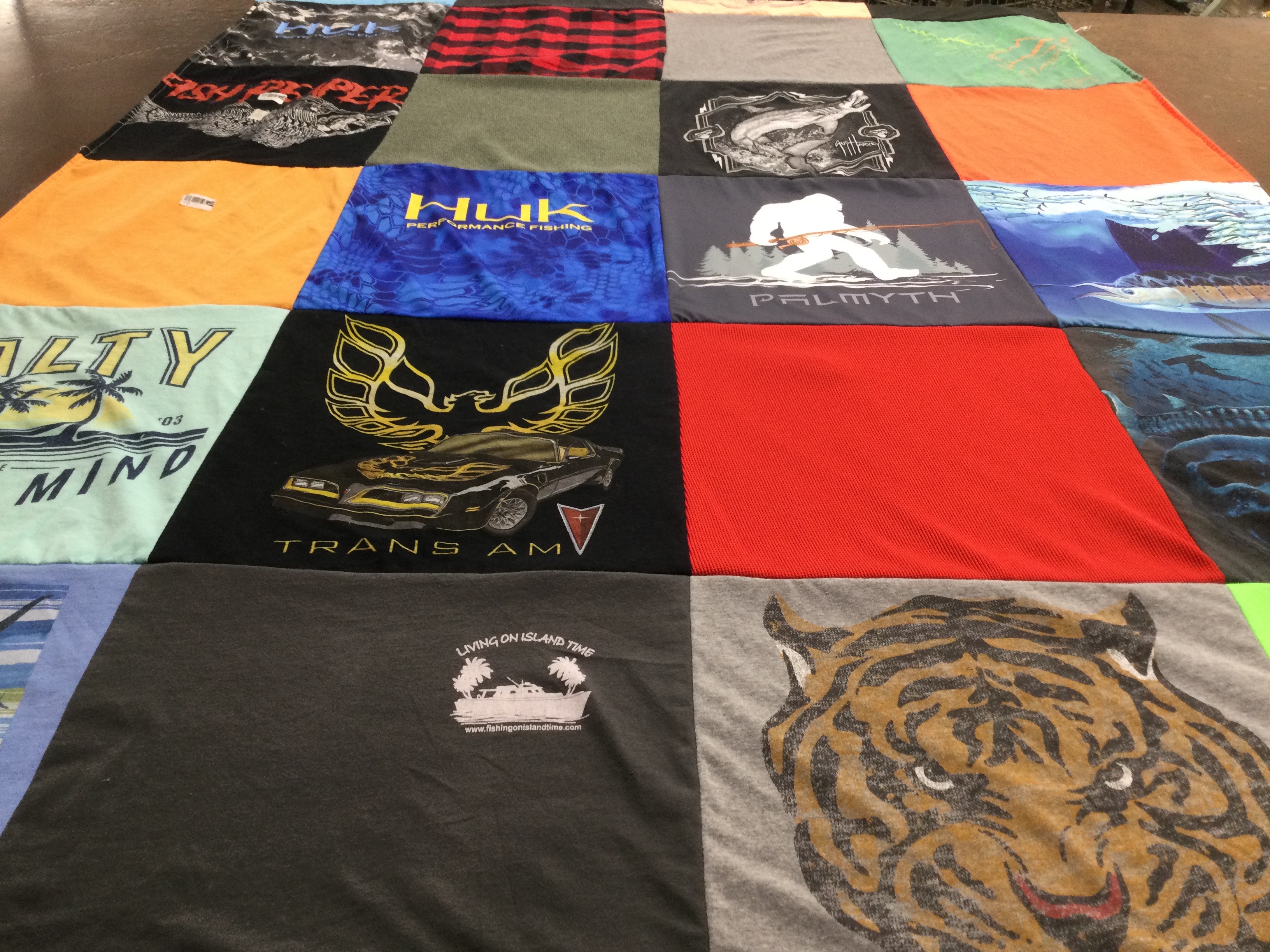 T-shirt quilt with fishing, cars themes by Mary from FL