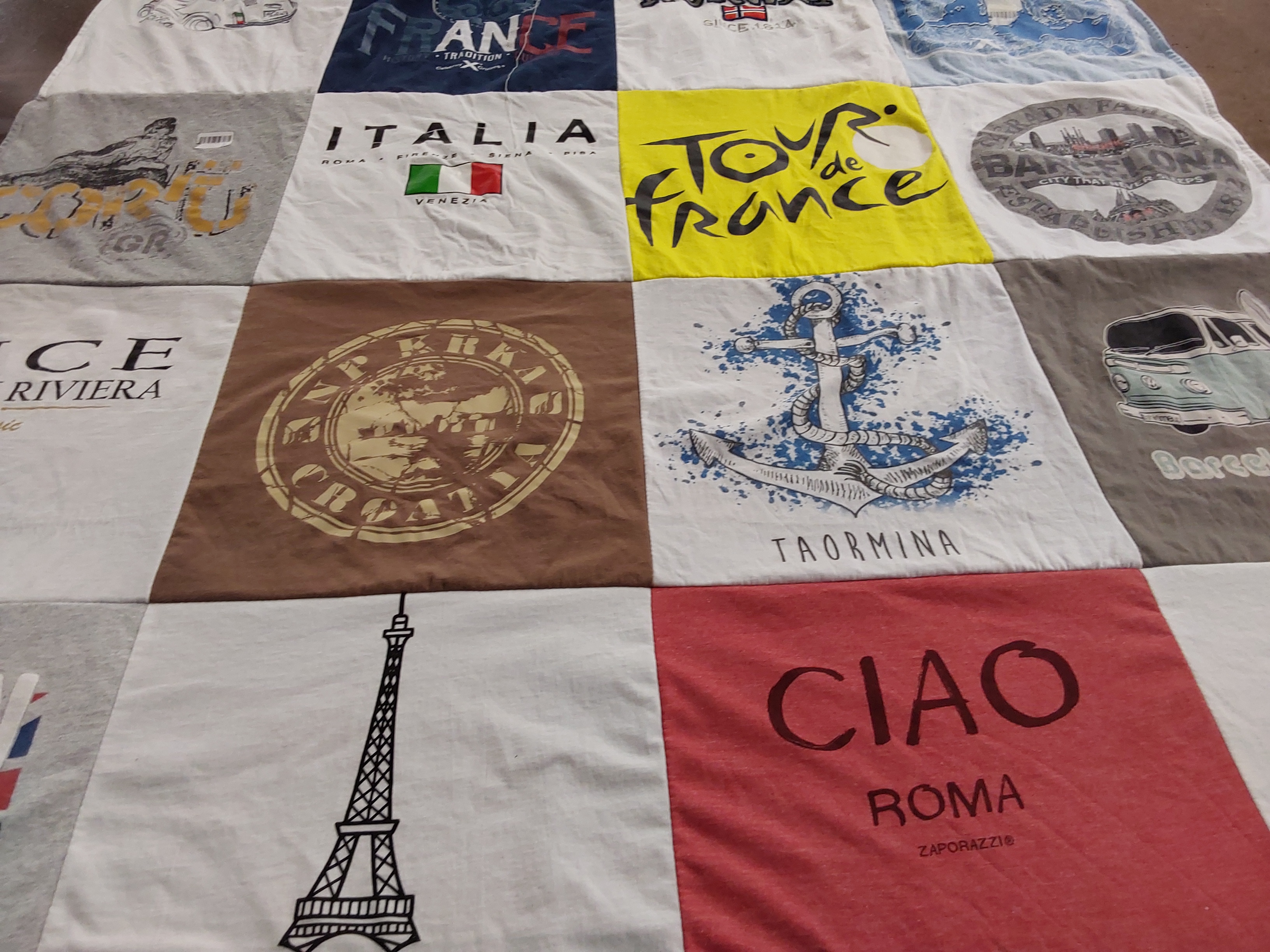 T-shirt quilt with travel, cultures themes by Gretchen from NY