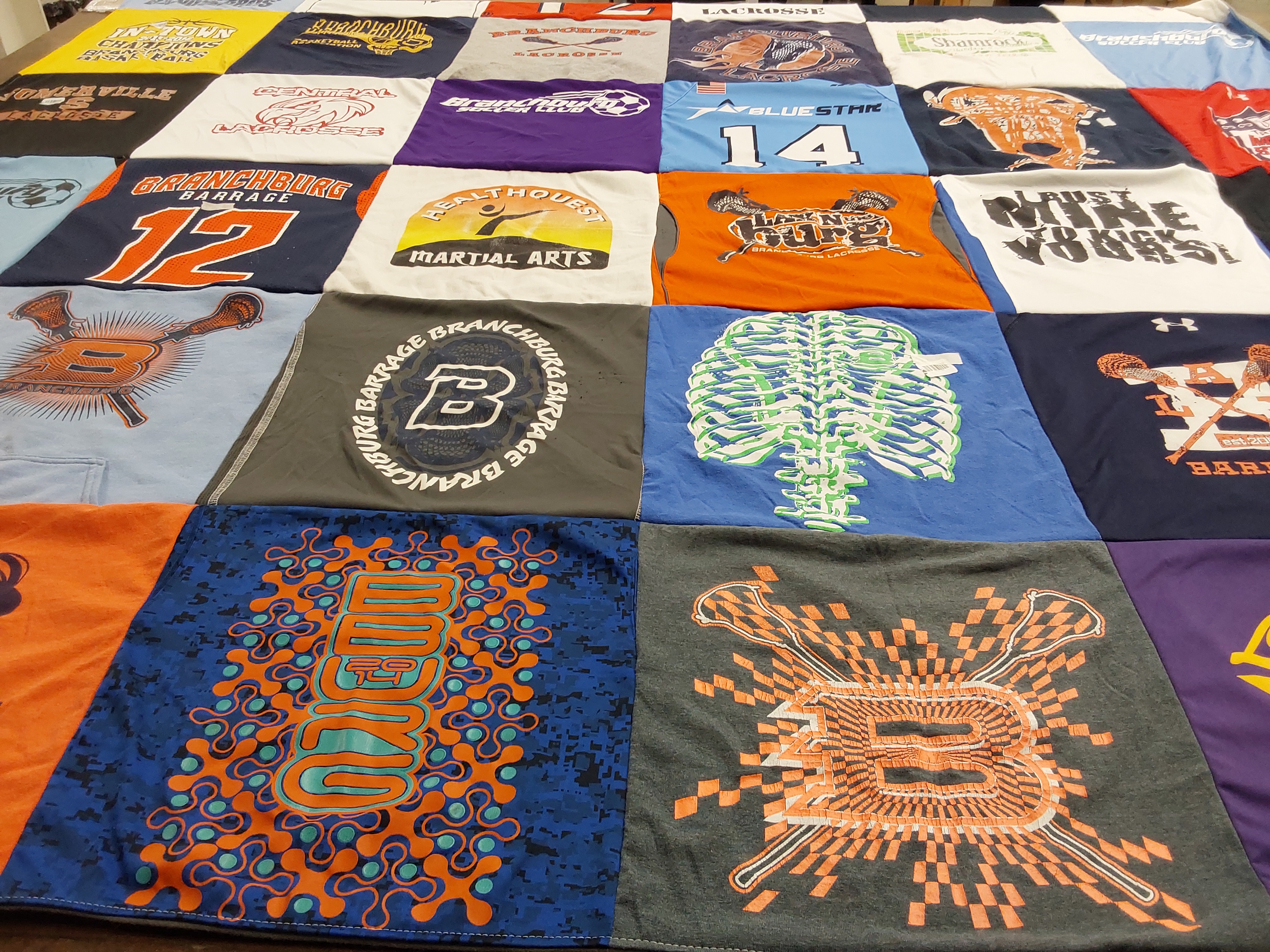 T-shirt quilt with lacrosse, martial arts themes by Shannon from NJ