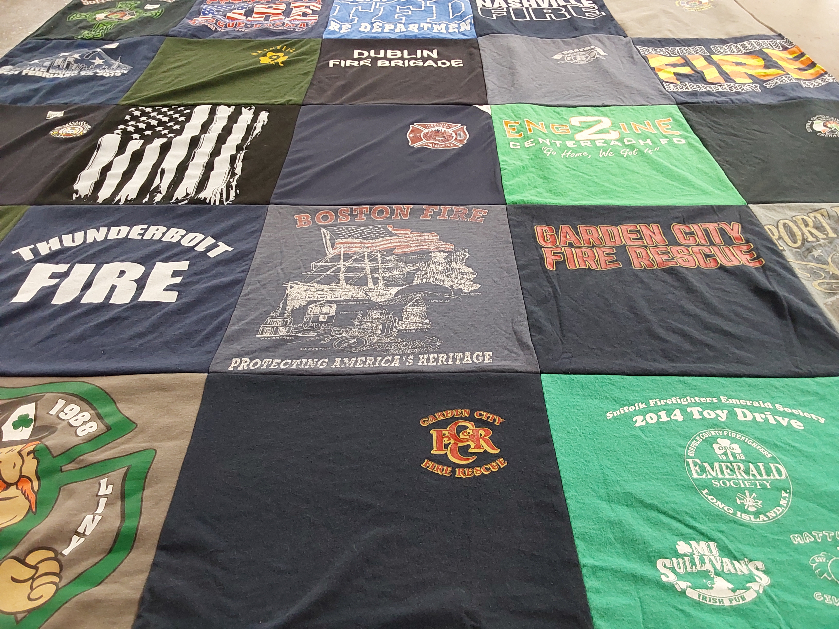 T-shirt quilt with firefighting, community themes by Cara from GA