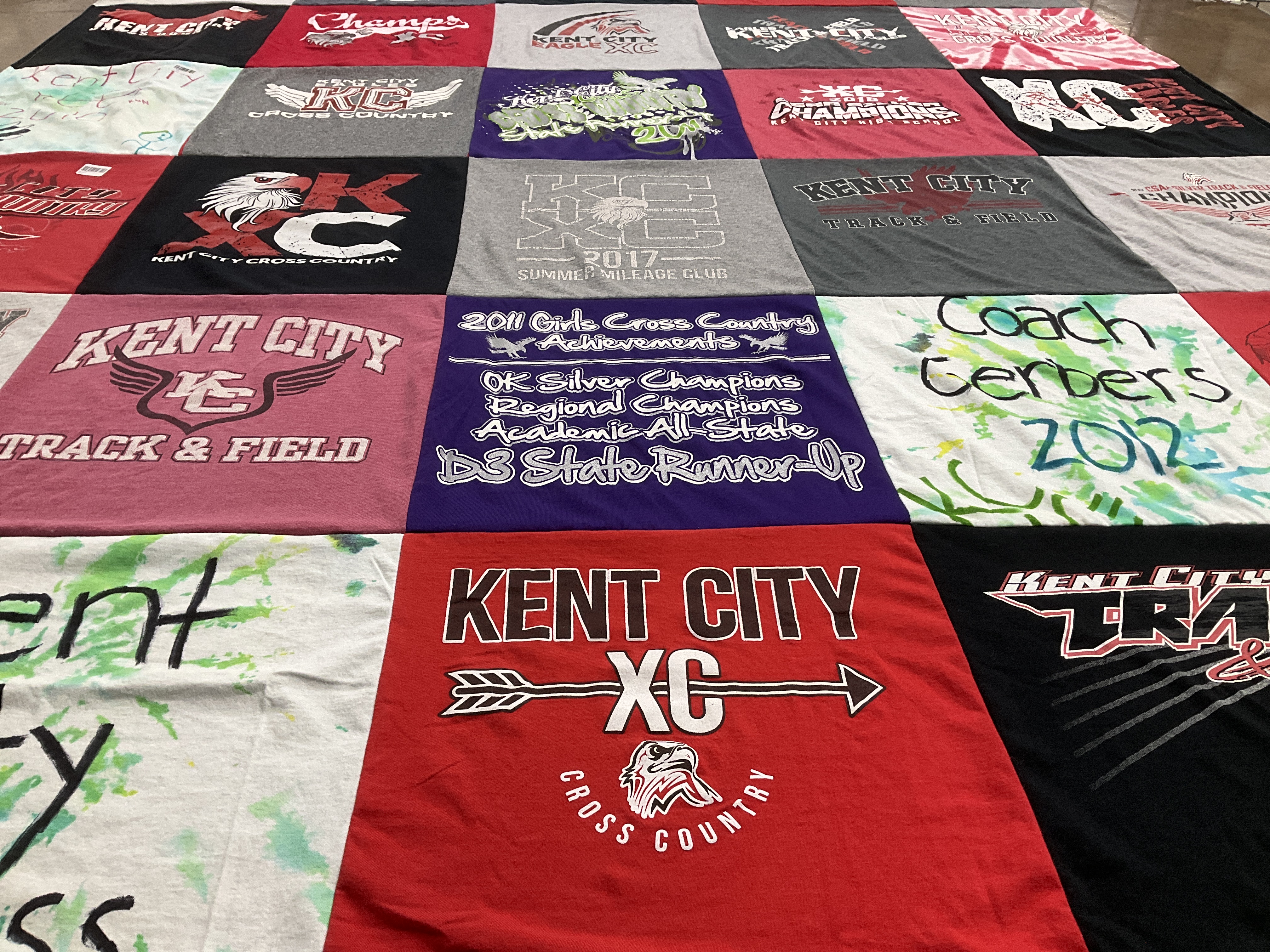 T-shirt quilt featuring kent city cross country, kent city track and field by Jamie from MI