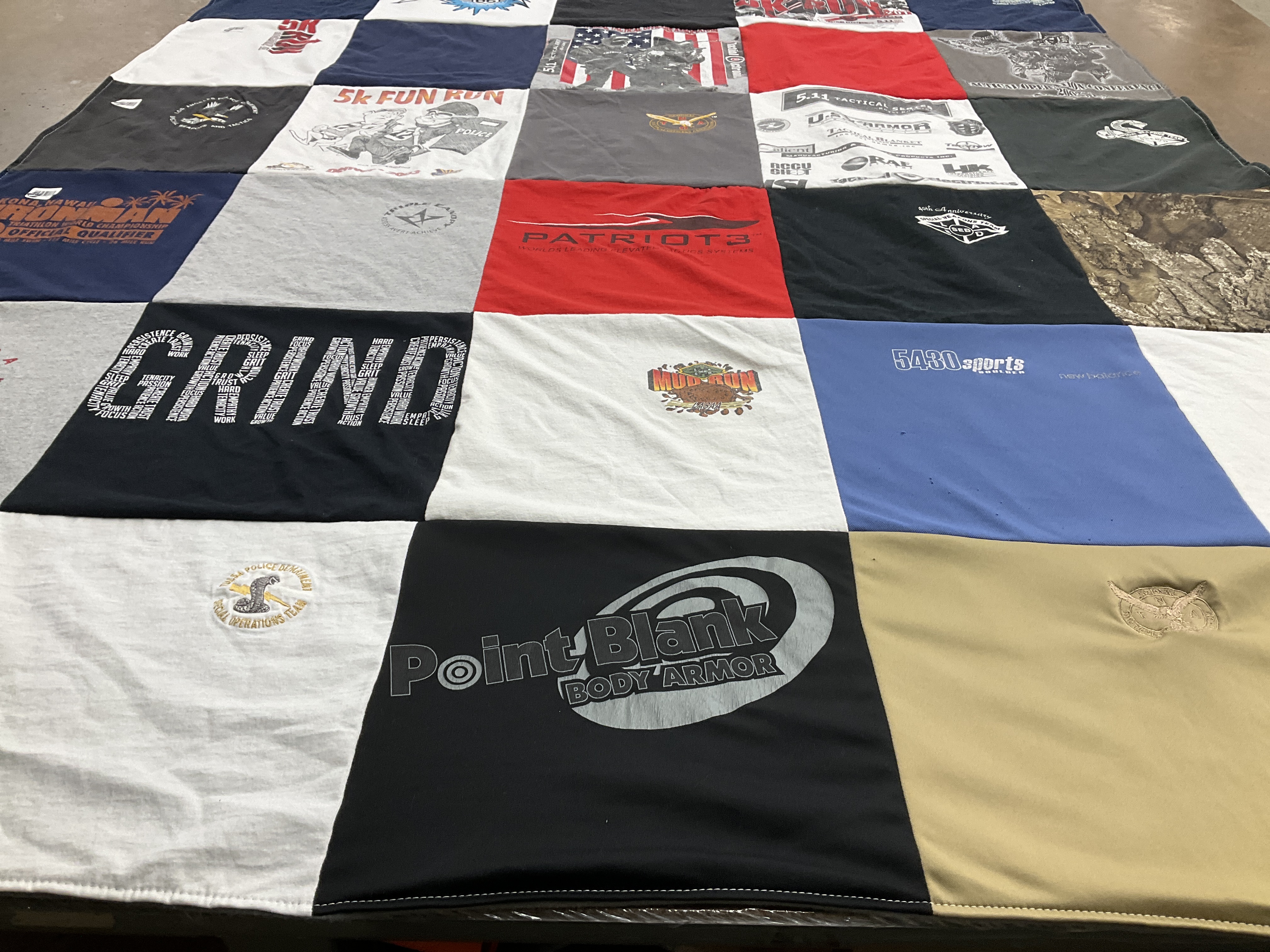 T-shirt quilt with sports, running themes by Lora from OK