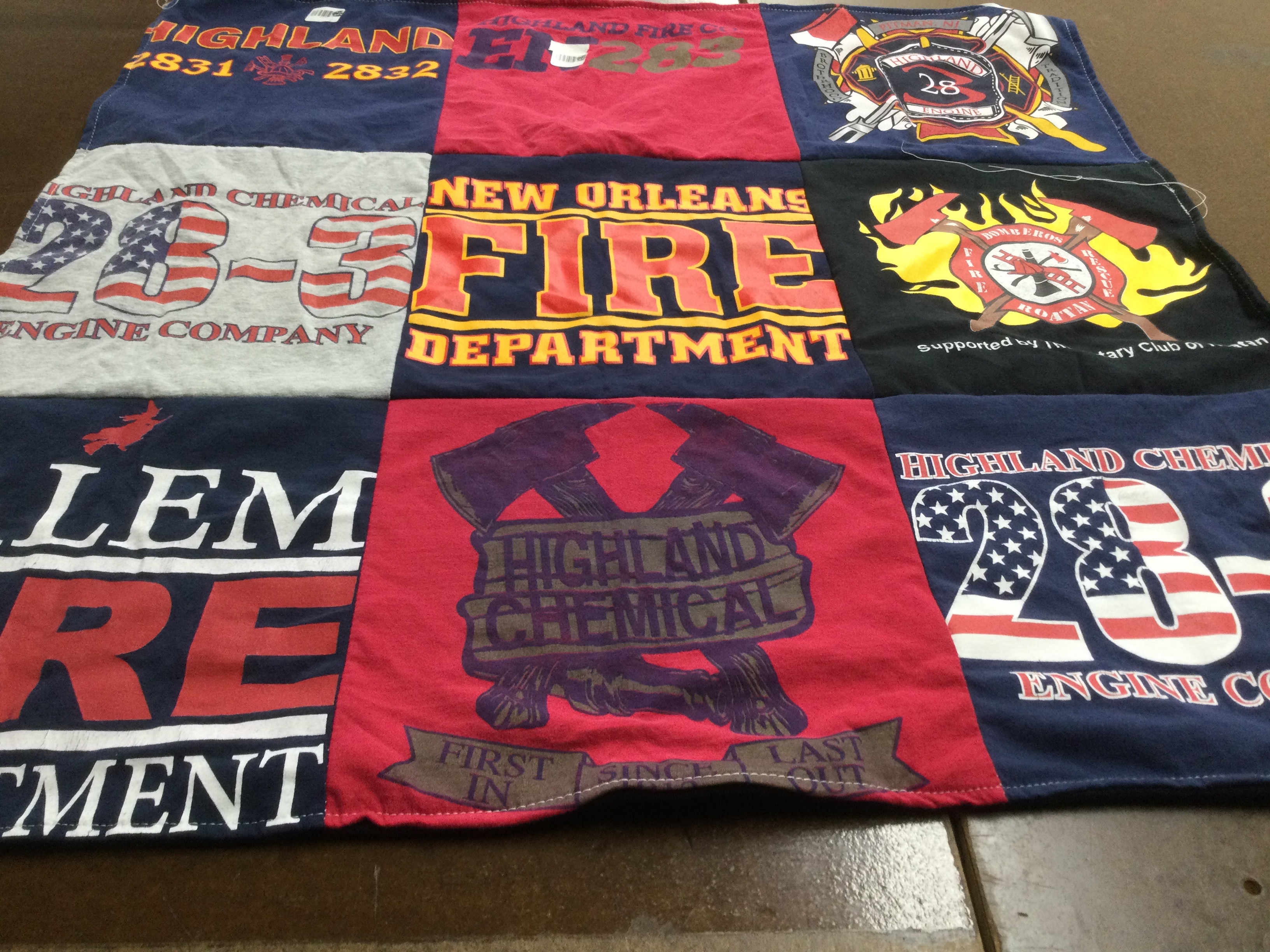 T-shirt quilt with firefighting, community service themes by Renee from NJ