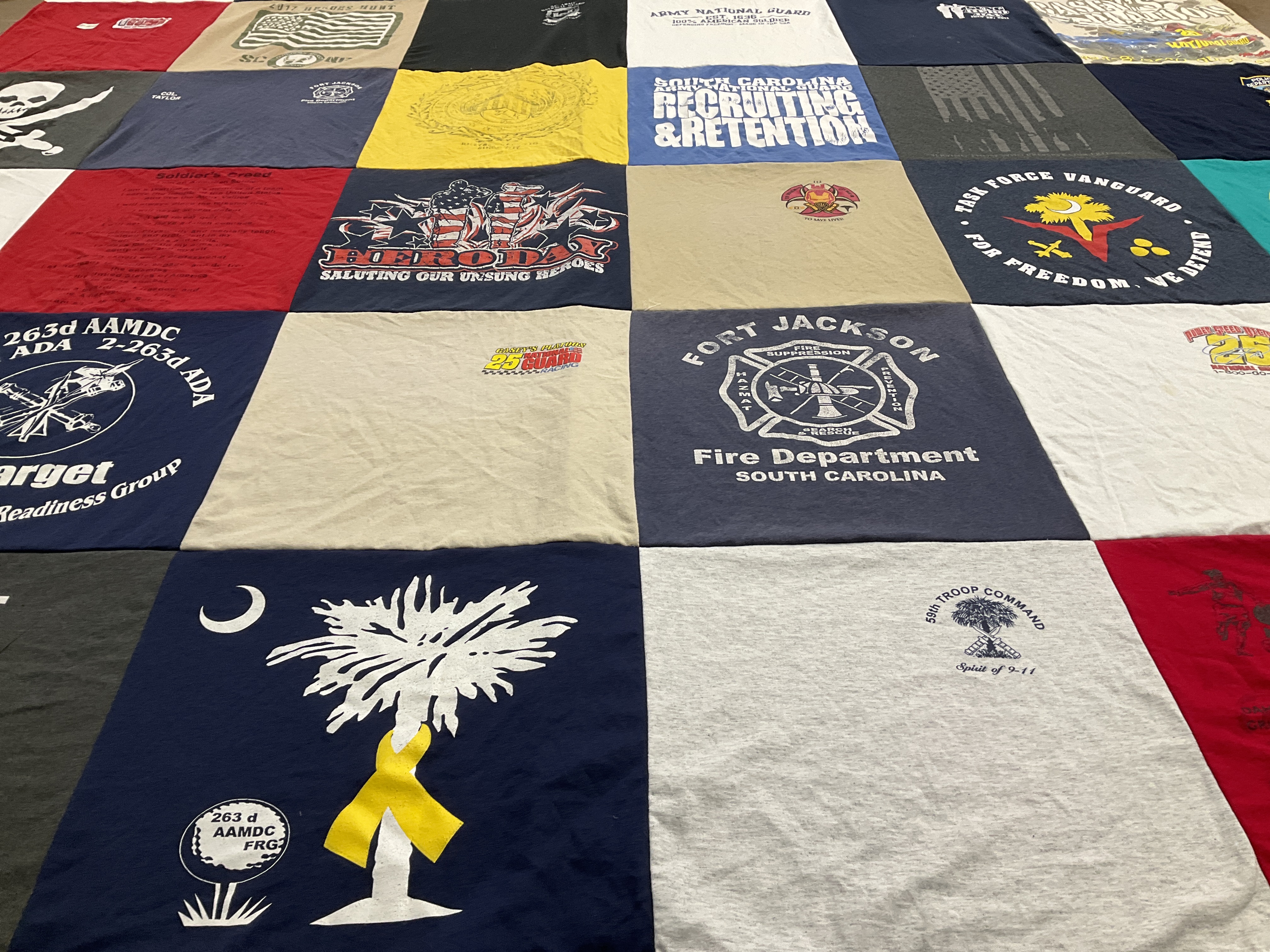 T-shirt quilt with military, firefighting themes by Elisa from SC