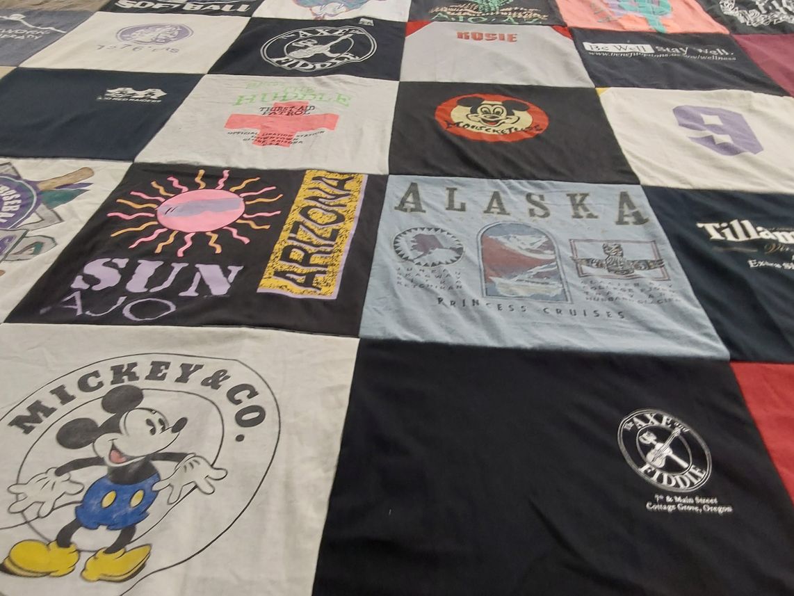 T-shirt quilt with travel, disney themes by Rosemary from AZ