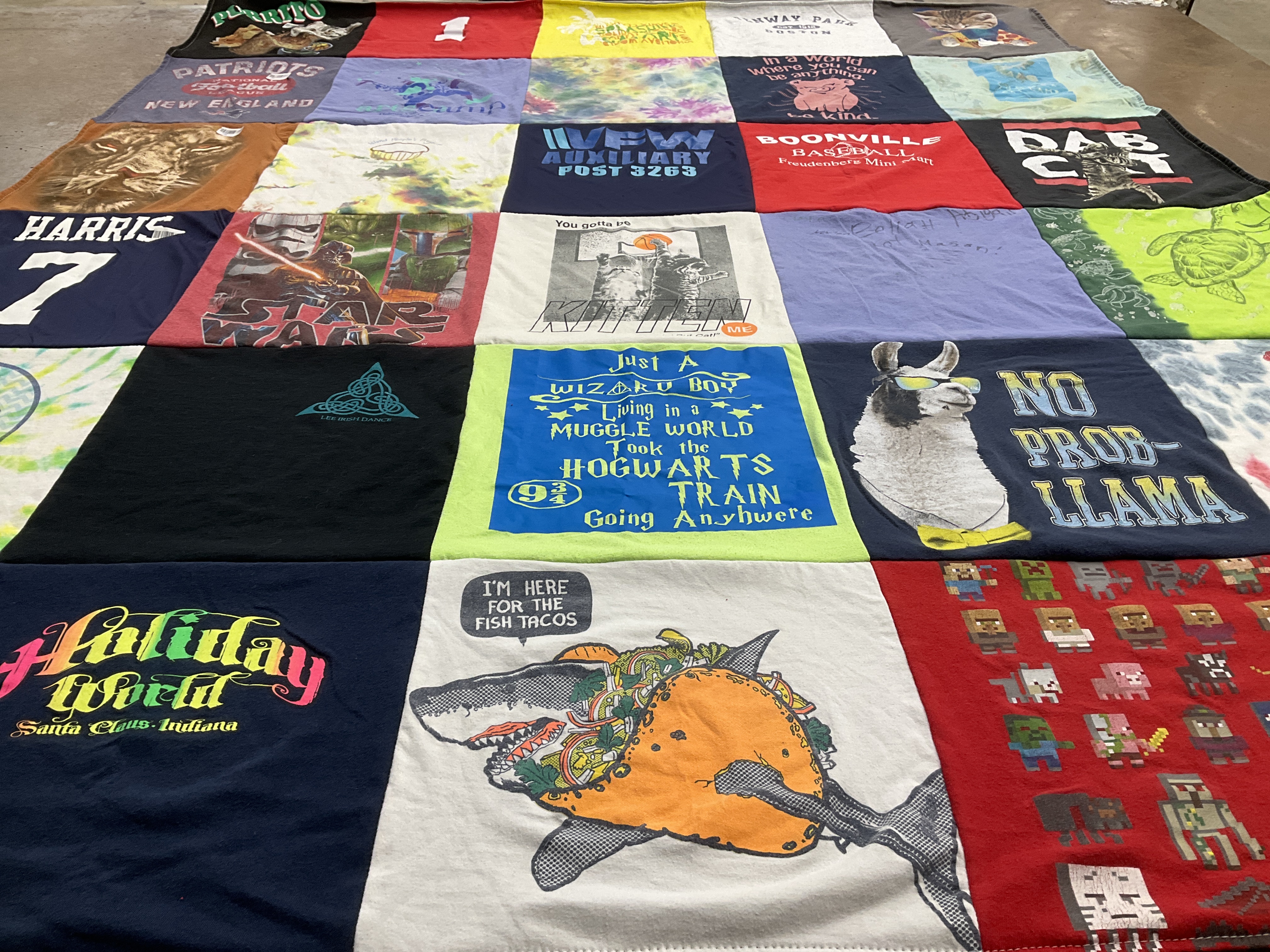 T-shirt quilt with sports, movies themes by Amy from NY
