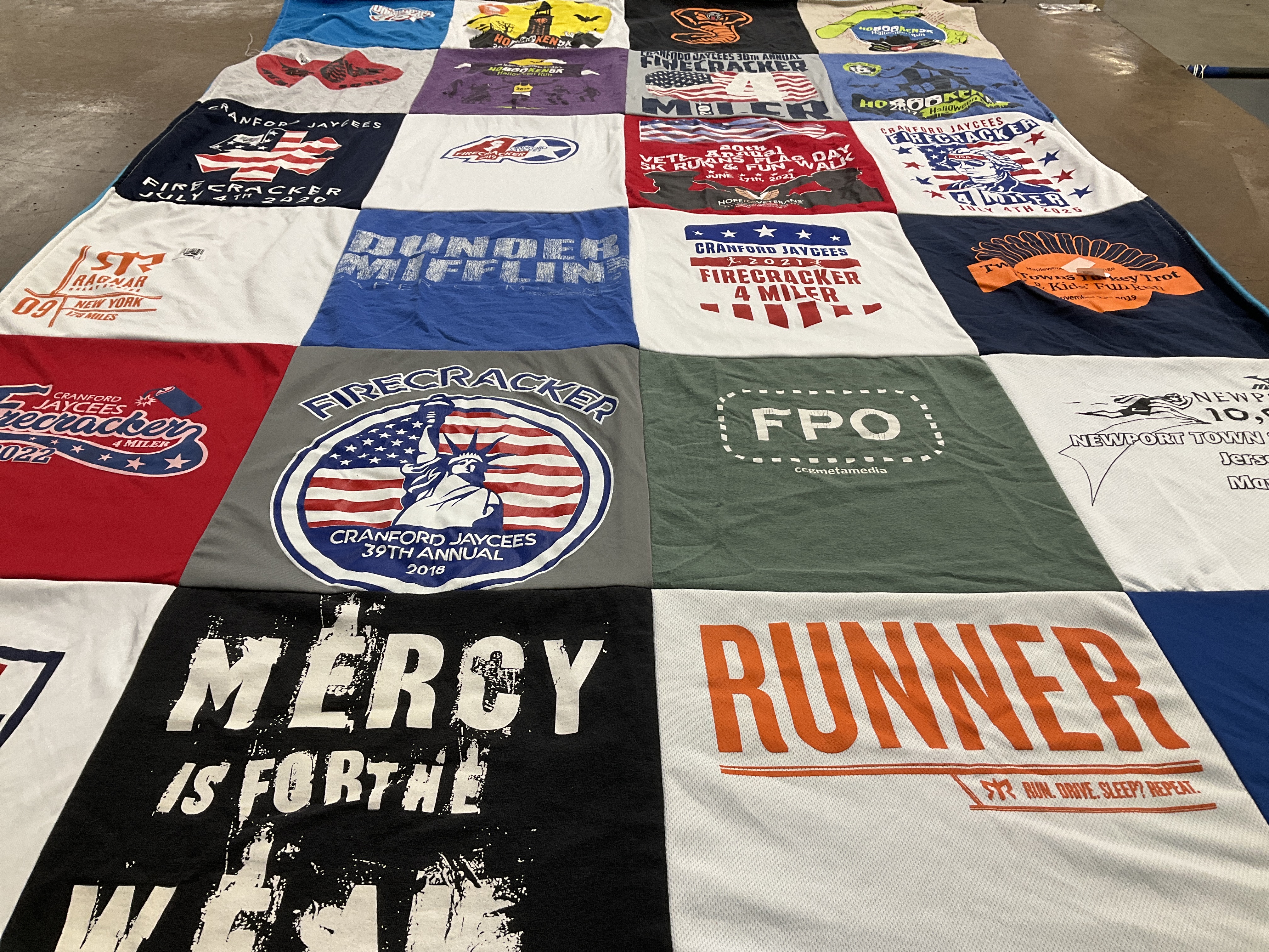 T-shirt quilt with running, community events themes by Lisa from NJ