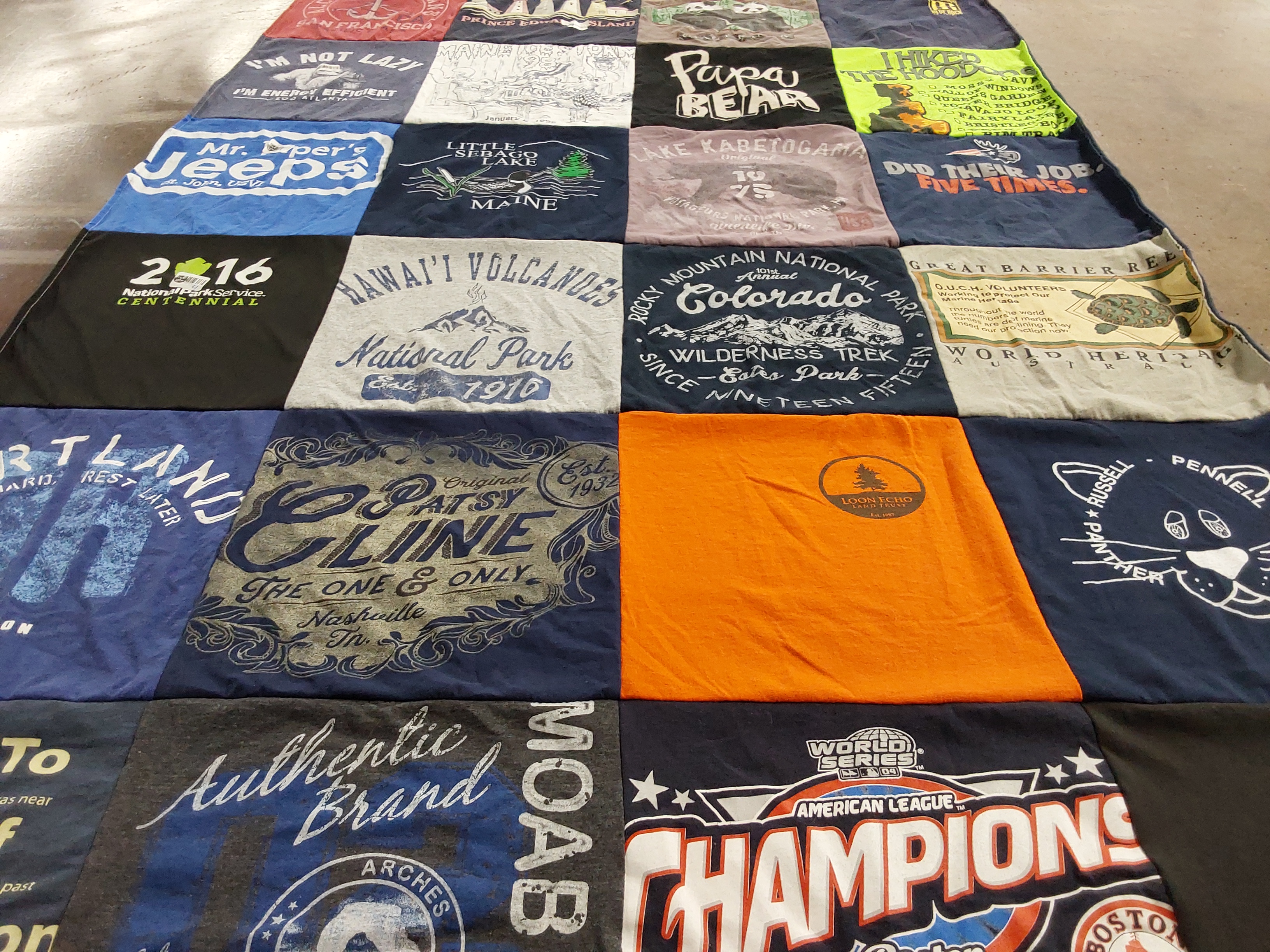 T-shirt quilt with hiking, travel themes by Deborah from ME