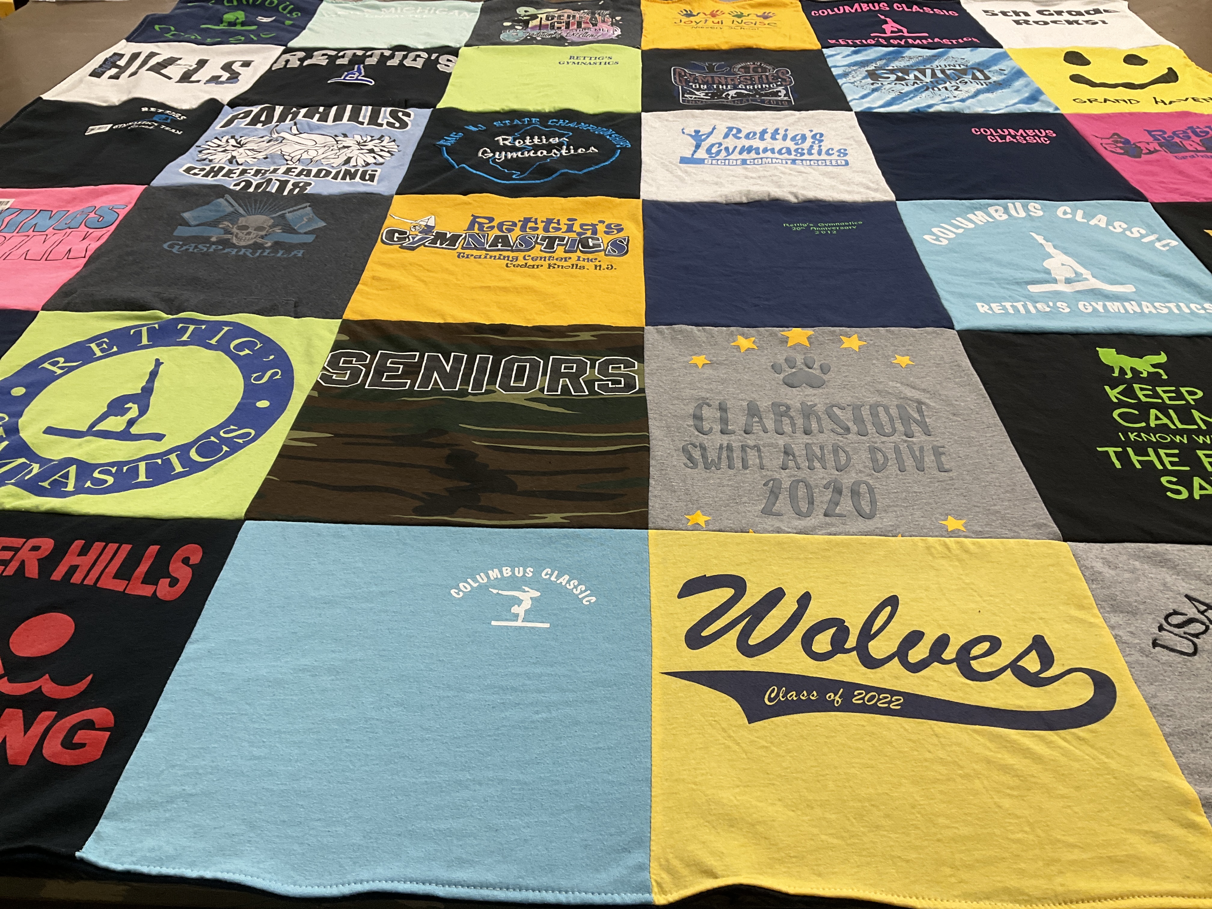 T-shirt quilt featuring rettig's gymnastics, clarion swim and dive by Jenn from MI