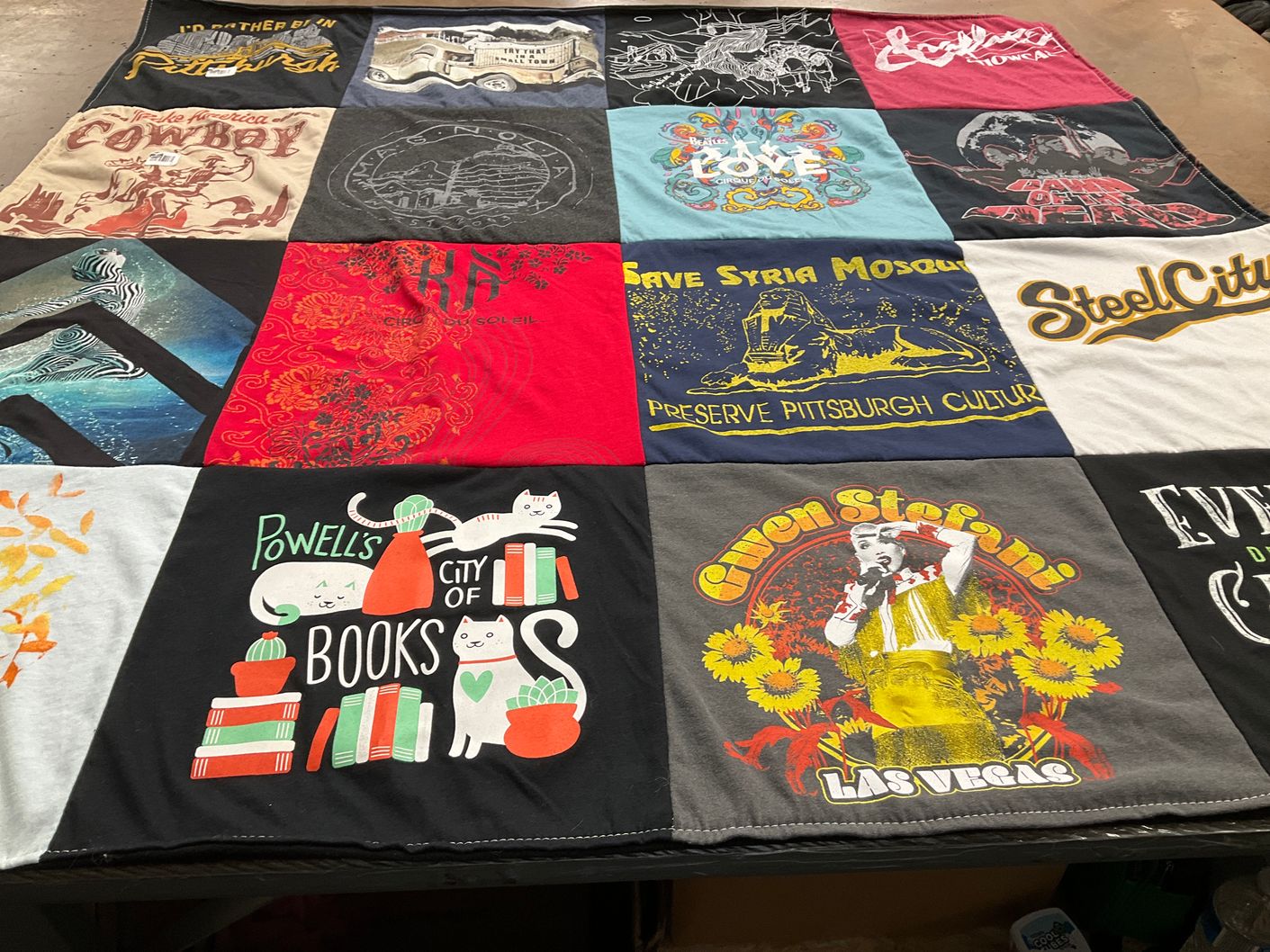 T-shirt quilt with reading, travel themes by Jennifer from AZ