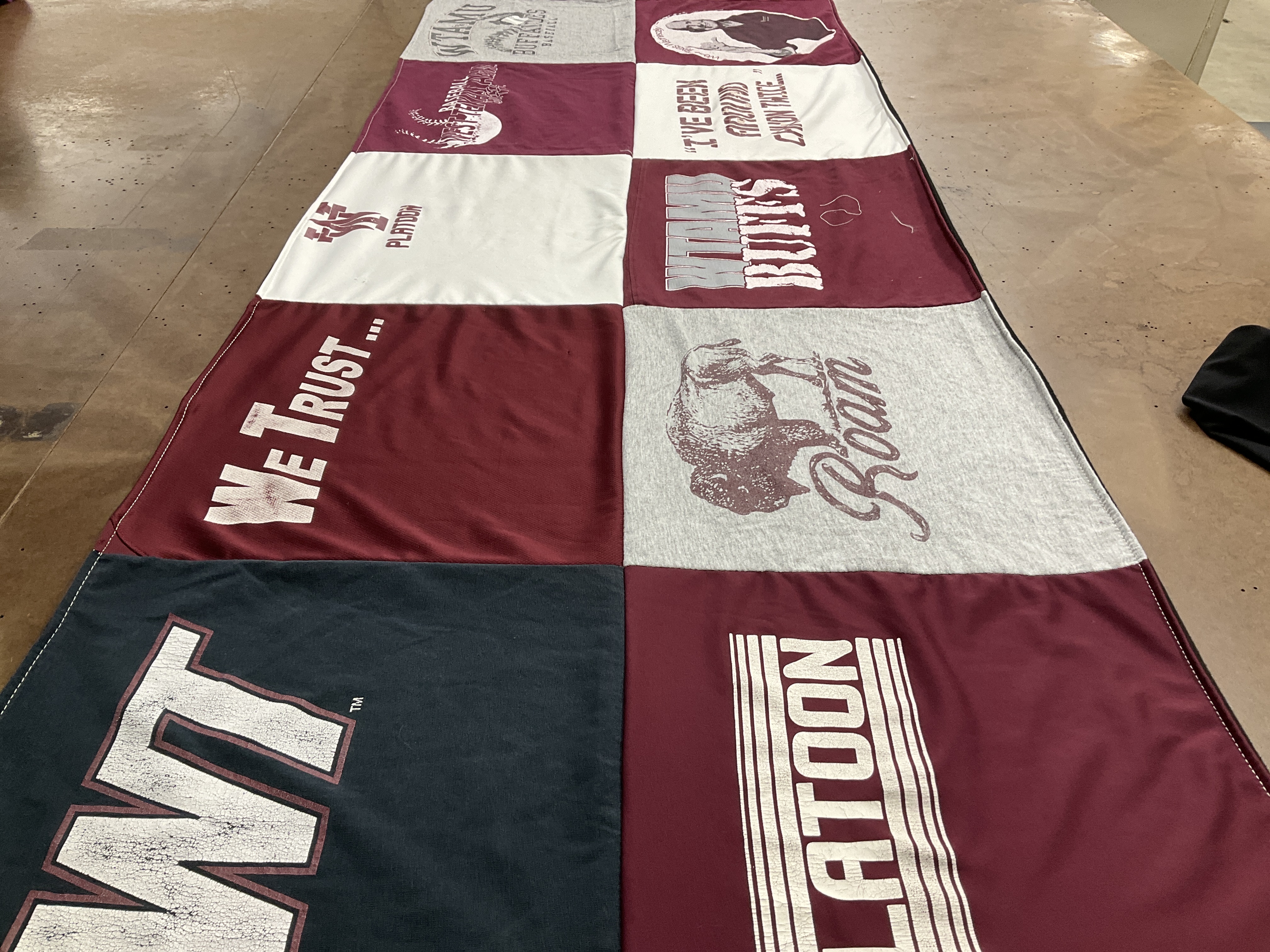 T-shirt quilt with sports, community themes by Kelly from TX