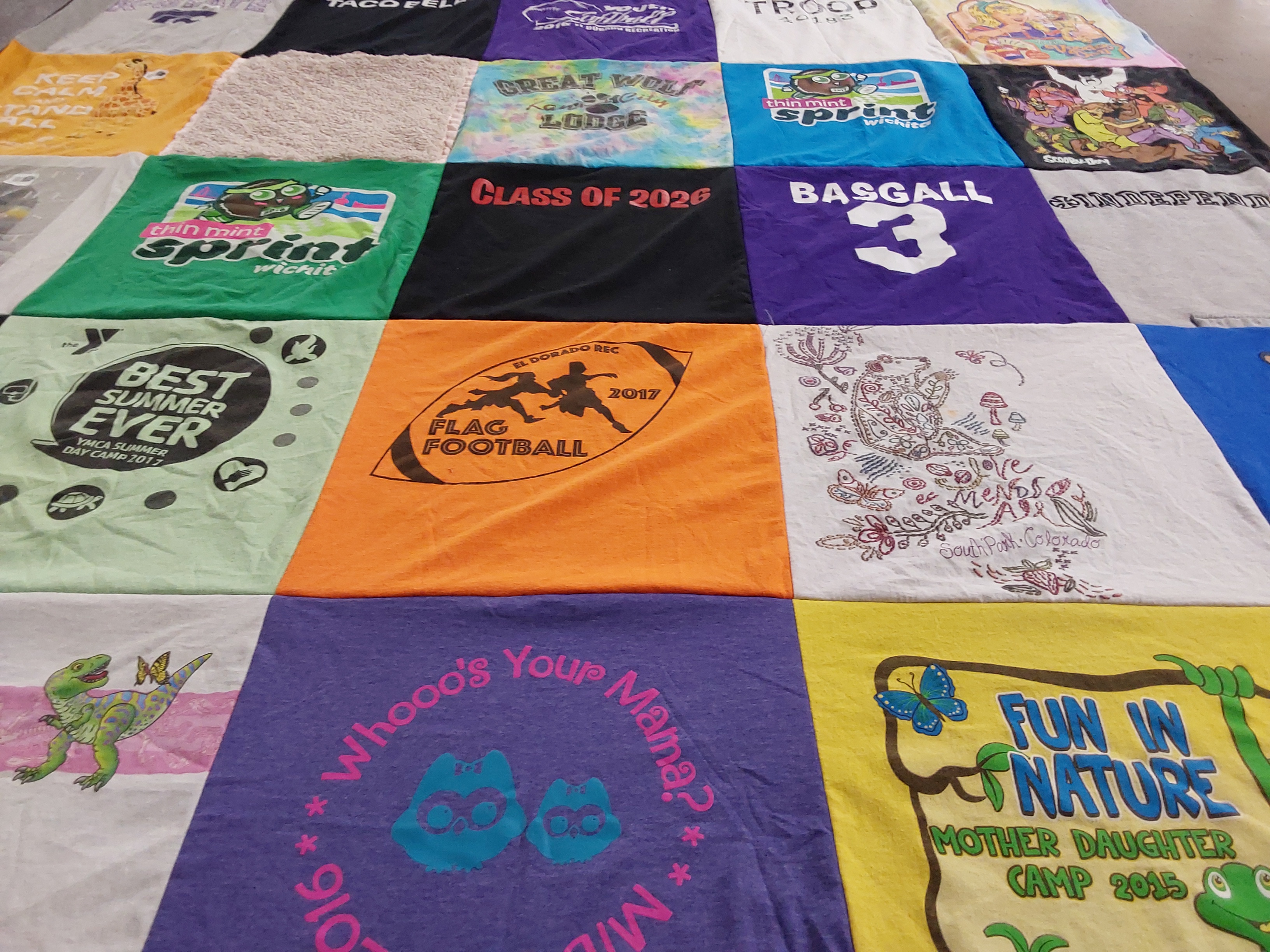 T-shirt quilt with camping, sports themes by Sherri from KS