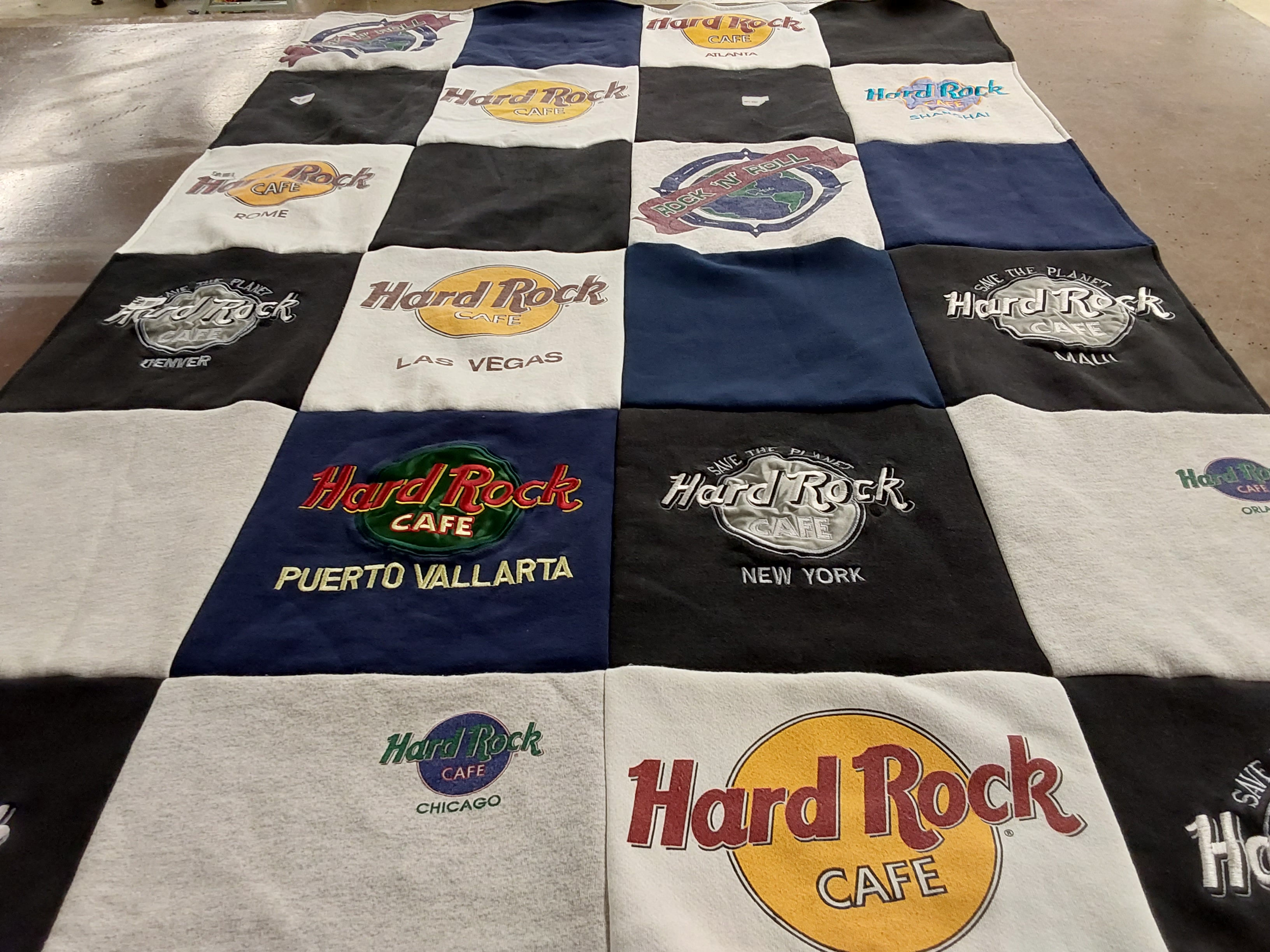 T-shirt quilt with music, travel themes by Janie from MI