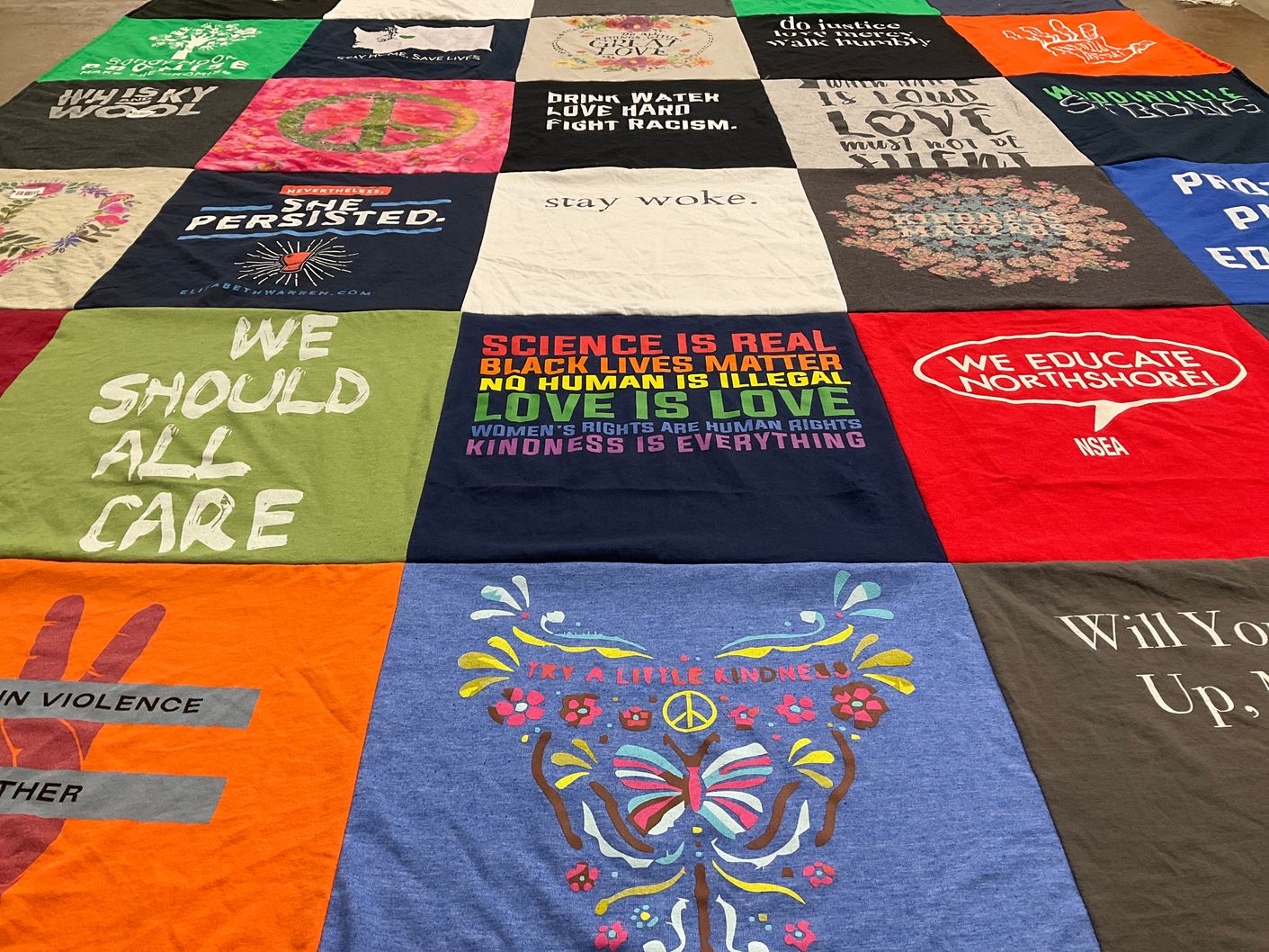 T-shirt quilt with social justice, equality themes by Margaret from WA