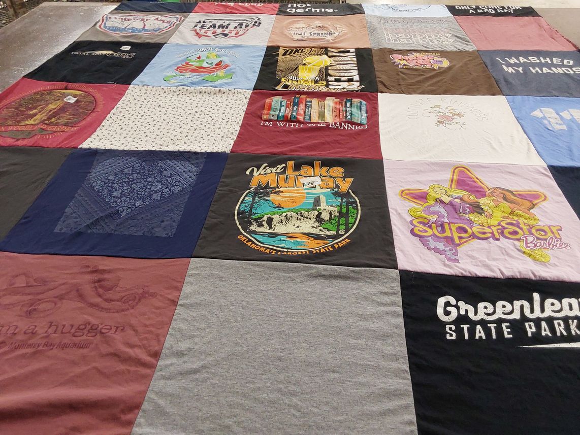 T-shirt quilt with hiking, travel themes by Rebecca from OK