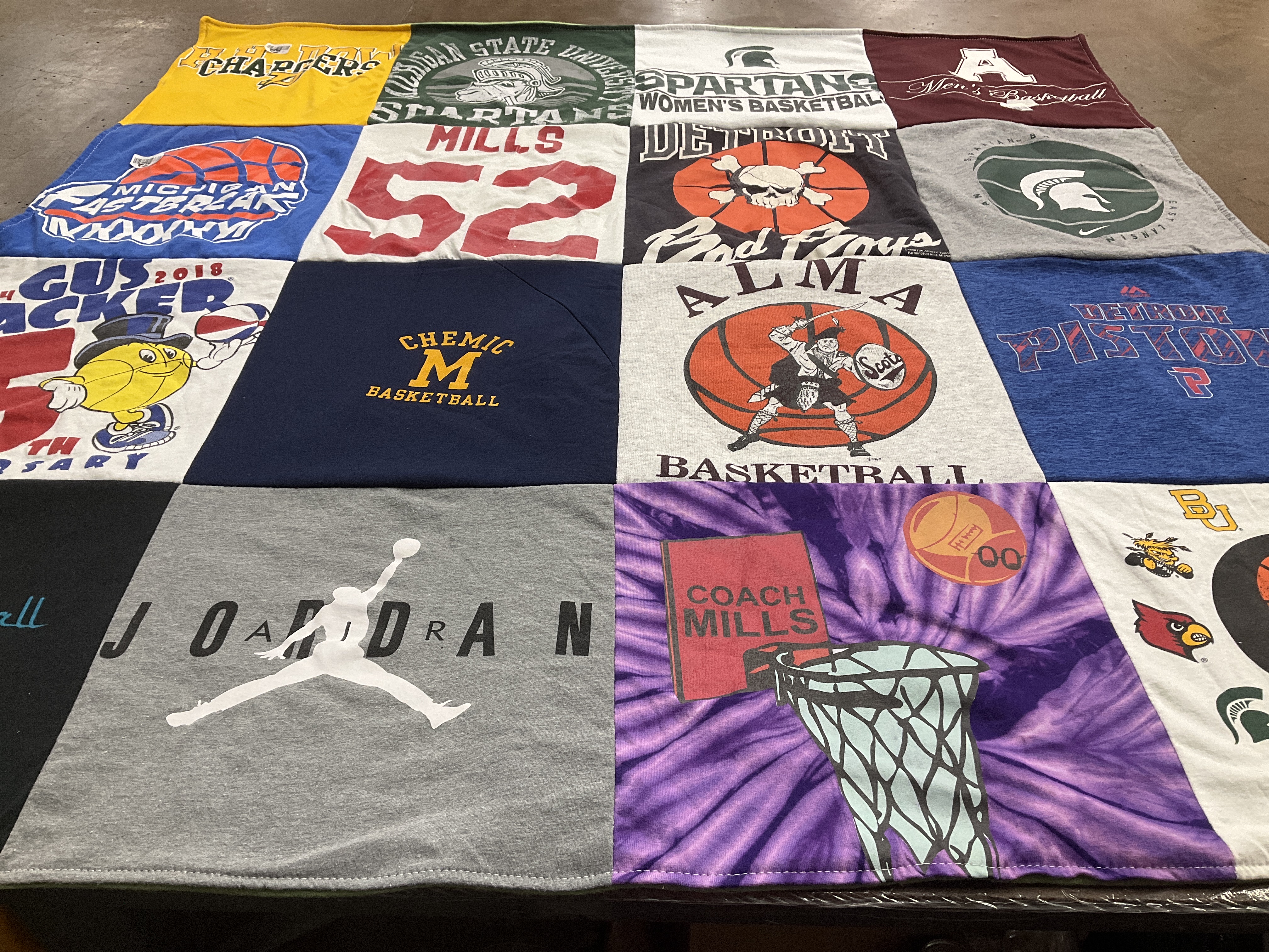 T-shirt quilt featuring detroit pistons, michigan state university spartans by Richard from MI