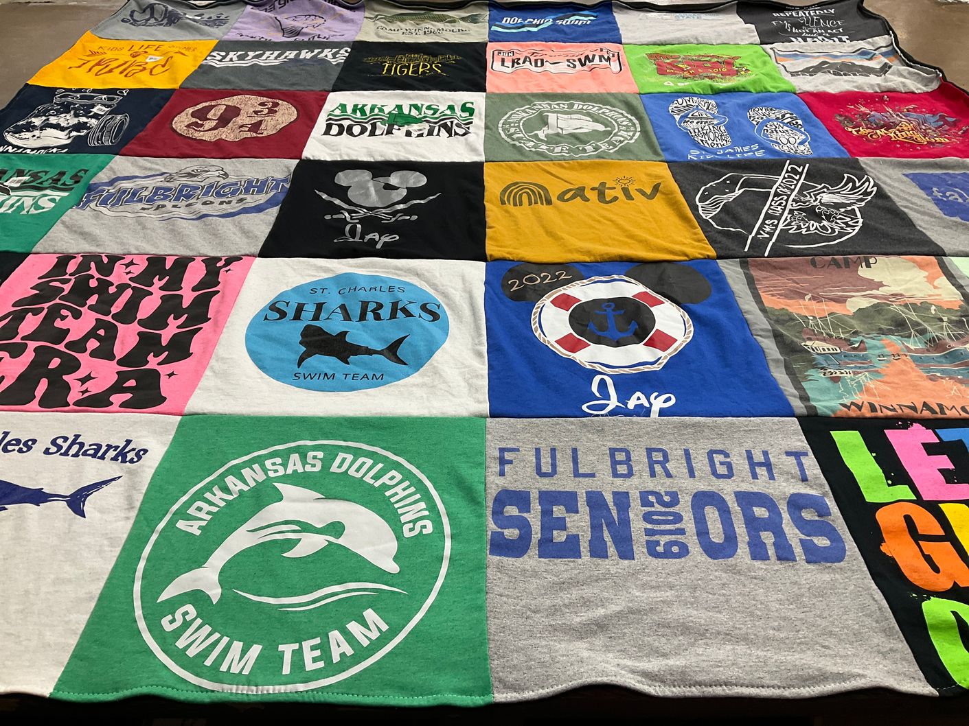 T-shirt quilt featuring st. charles sharks swim team, arkansas dolphins swim team by Amanda from AR