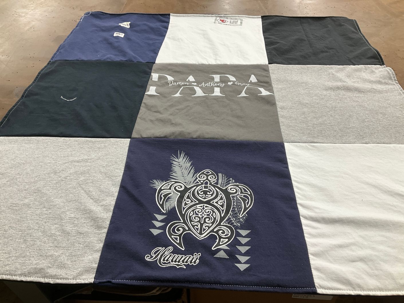 T-shirt quilt with family, travel themes by Melissa from IA