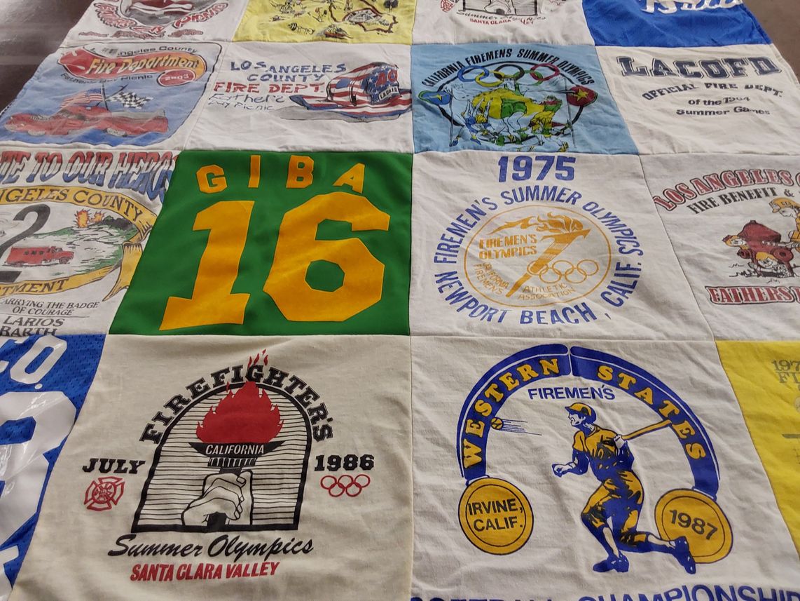 T-shirt quilt with firefighting, olympic sports themes by Barbara from CA
