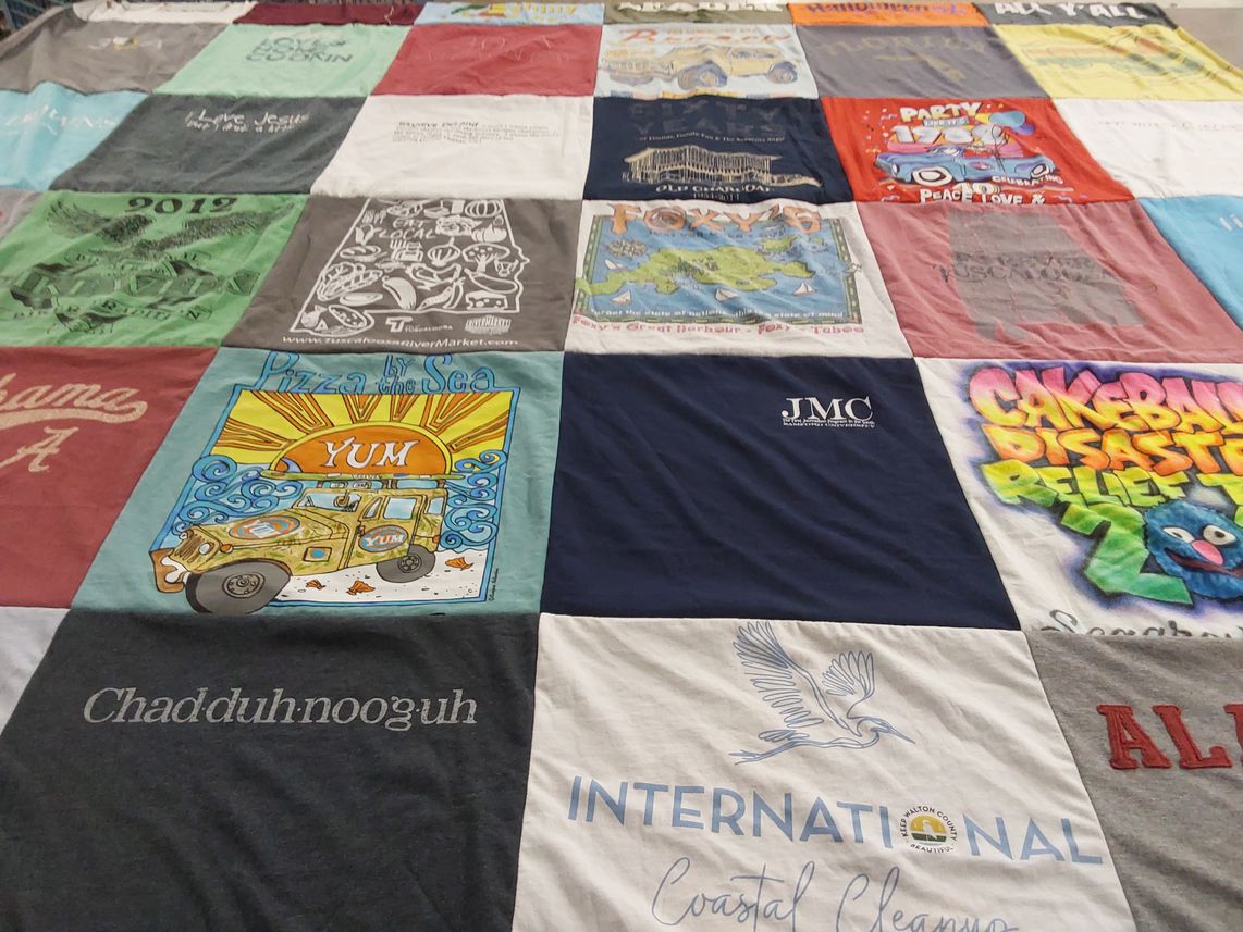 T-shirt quilt with food, cleaning themes by Mandy from FL