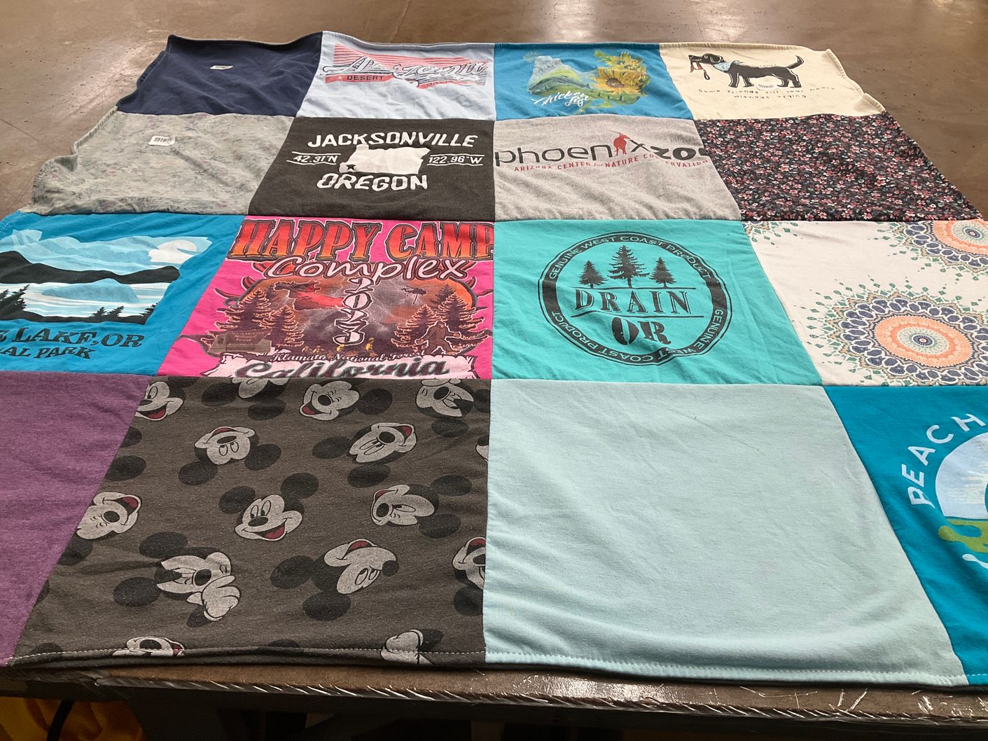 T-shirt quilt with travel, outdoors themes by Darien from OR