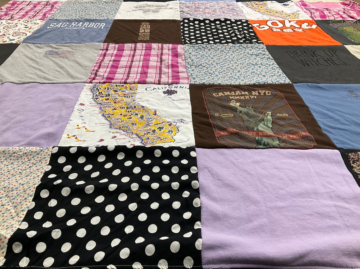 T-shirt quilt with travel, festivals themes by Dorothy from CT