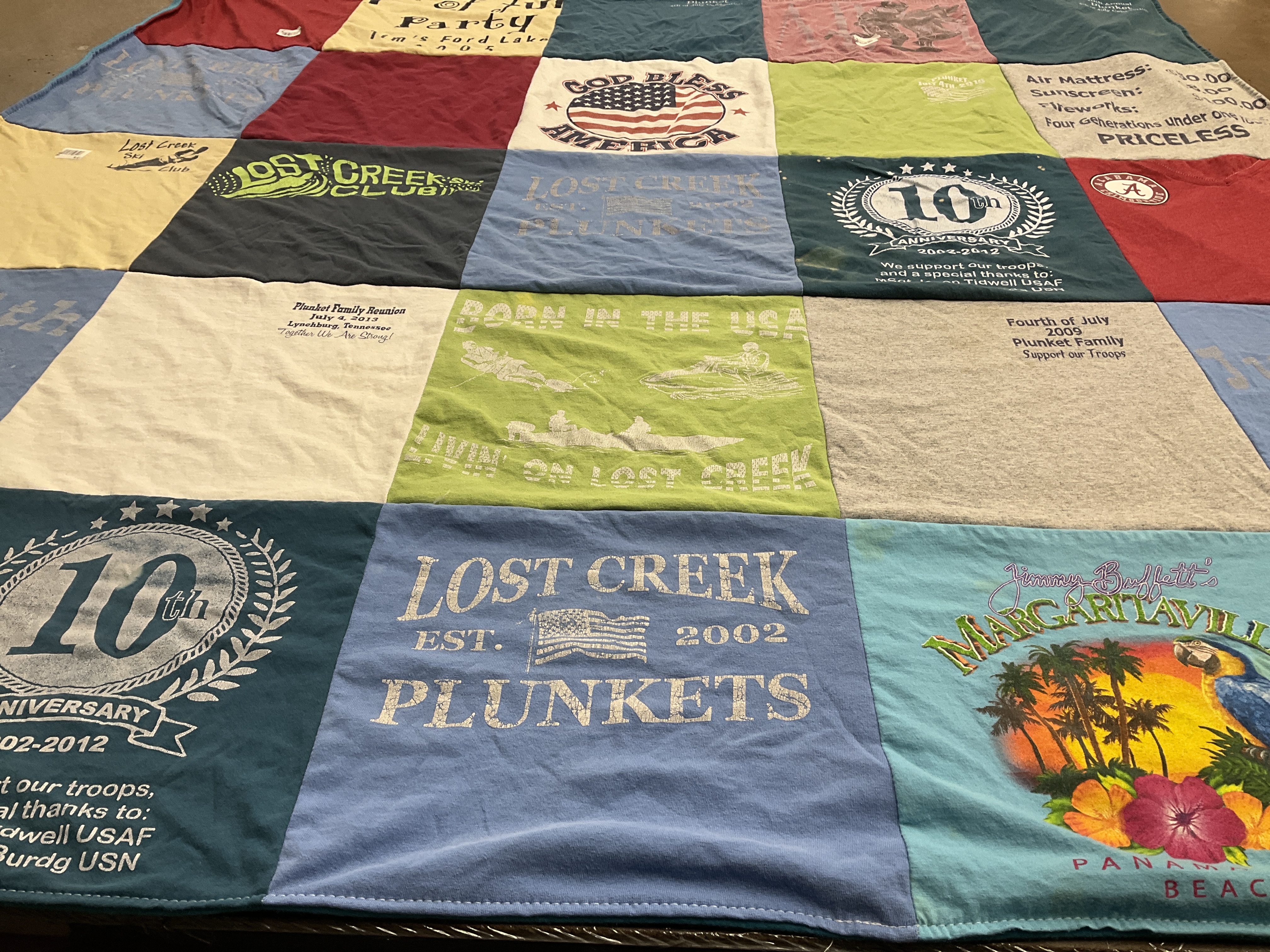 T-shirt quilt with family reunions, supporting troops themes by Donna from AL