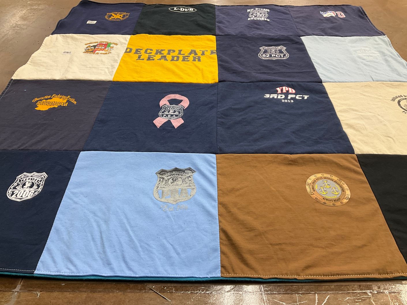 T-shirt quilt with public safety, firefighting themes by Dennine from NY
