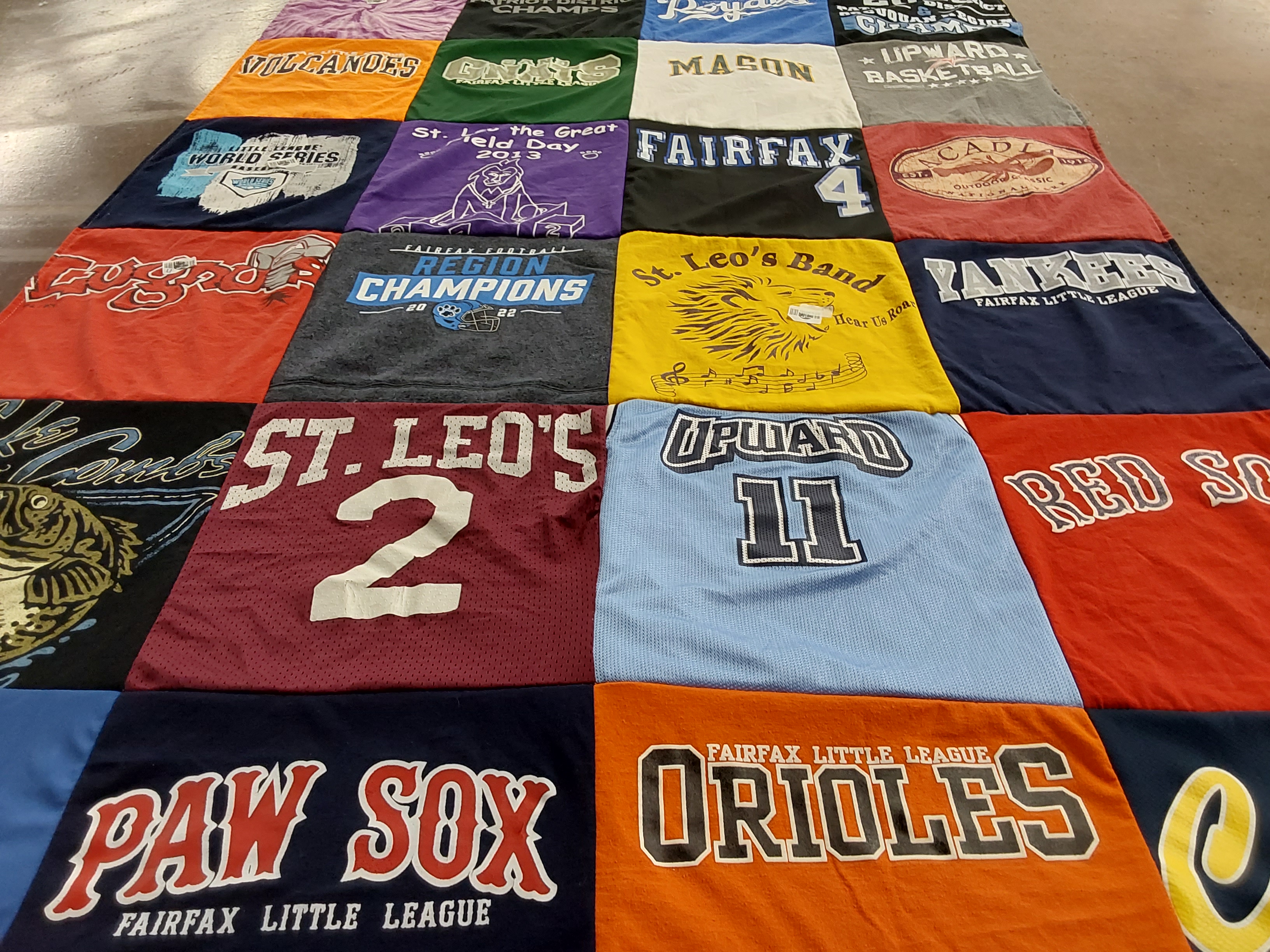 T-shirt quilt with sports, music themes by Cara from VA