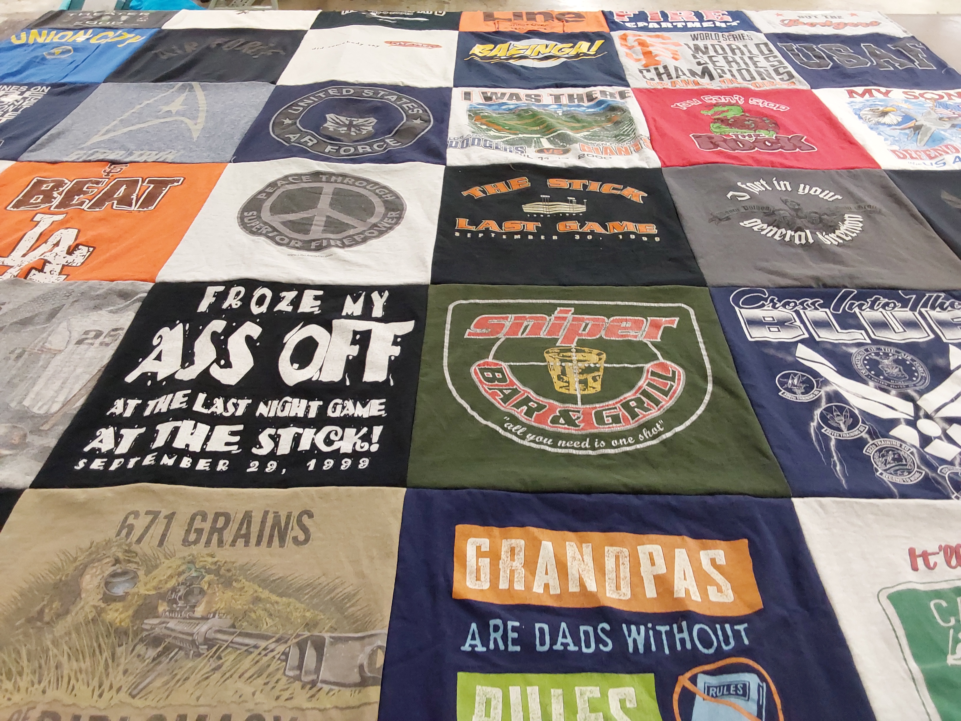 T-shirt quilt with sports, hunting themes by Cynthia from NM