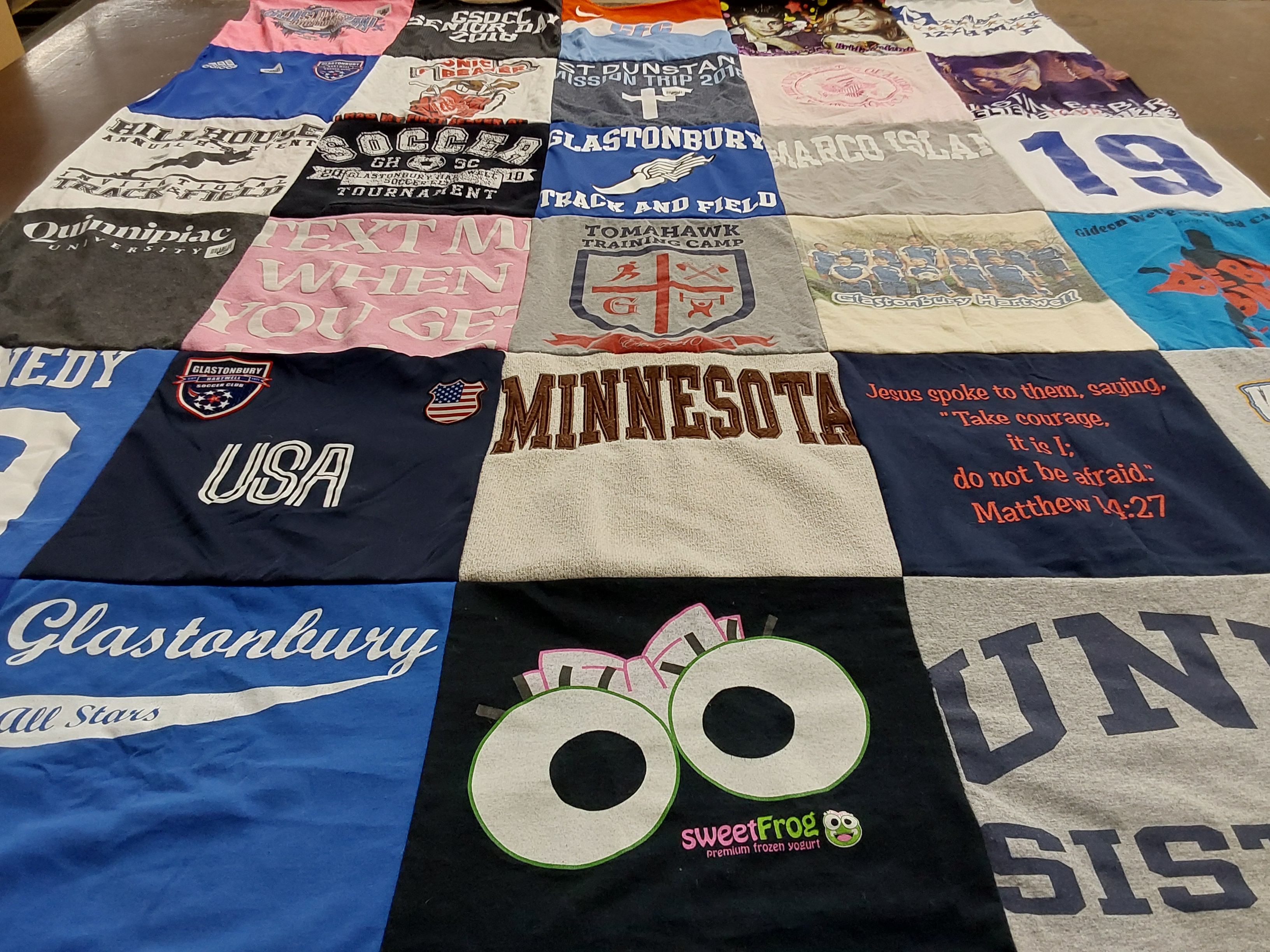 T-shirt quilt featuring glastonbury all stars by Amy from CT