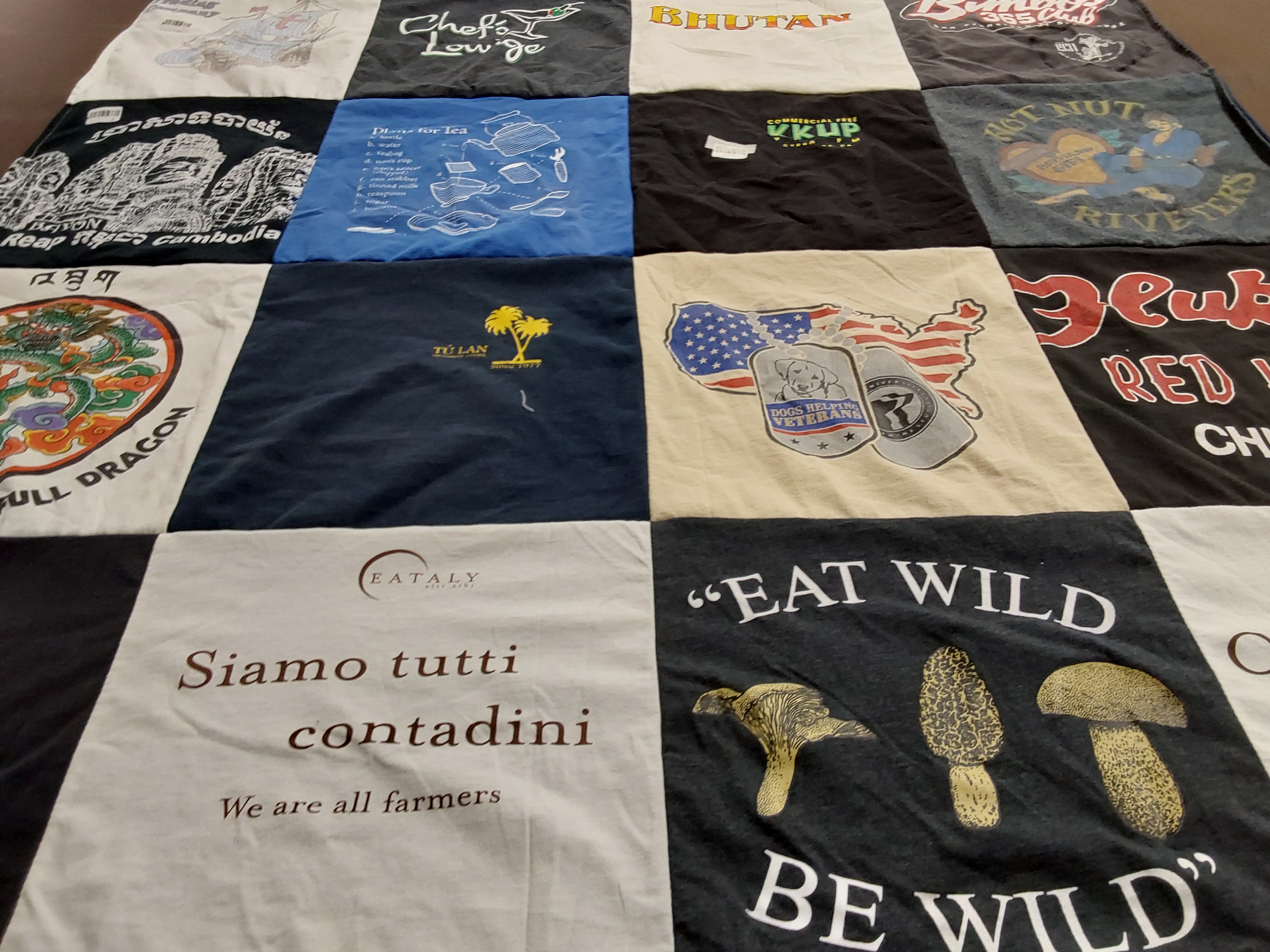 T-shirt quilt with cooking, veterans support themes by Sara from CA